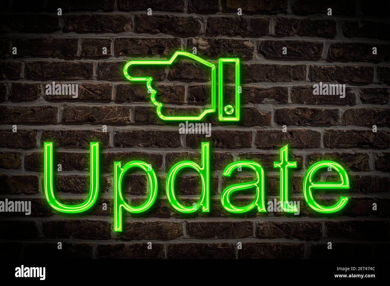 Detail photo of a neon sign on a wall with the inscription Update Stock Photo
