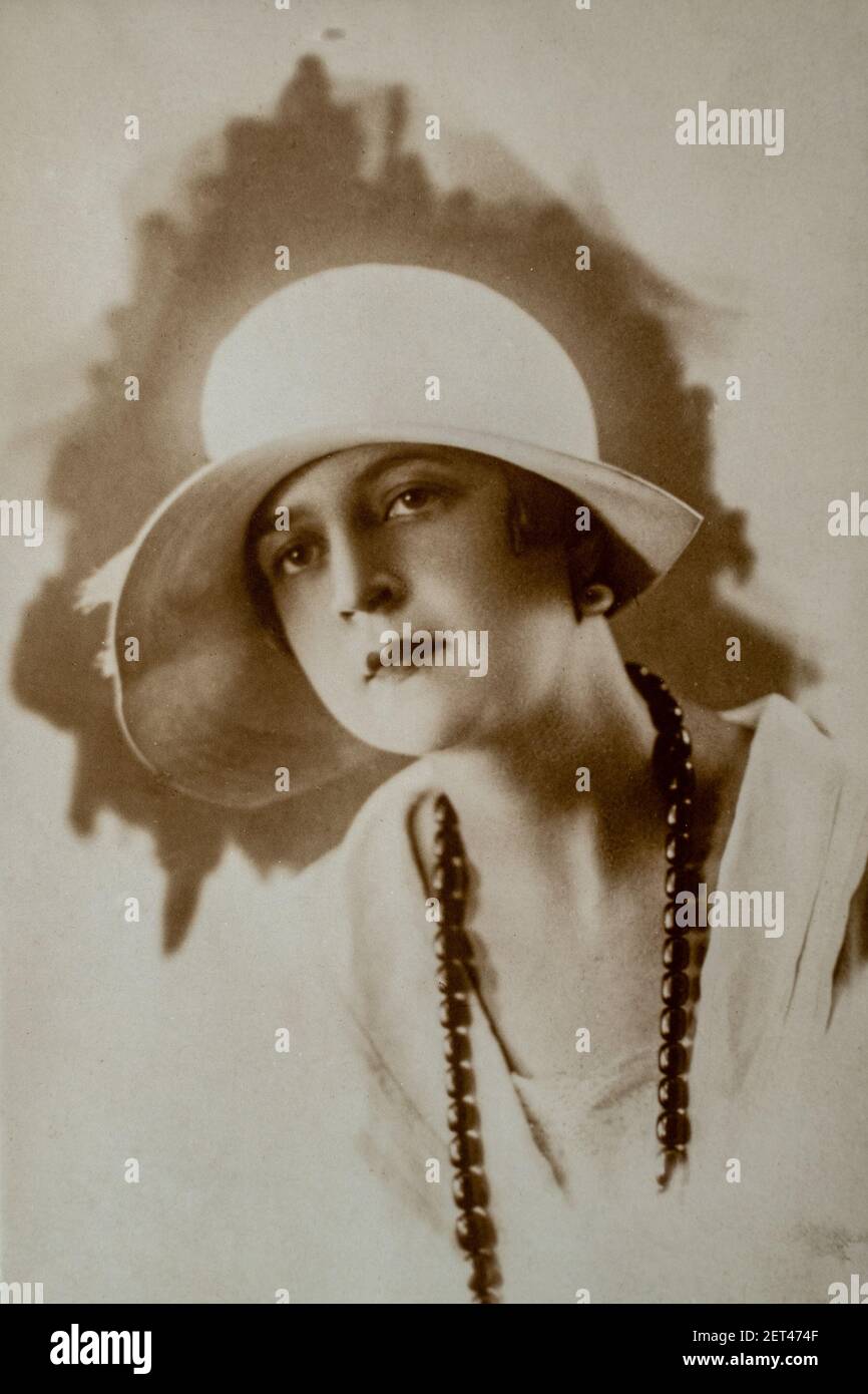 Germany - CIRCA 1920s: Portrait of female in studio. Lady with hat. Vintage Carte de Viste Art Deco era photo. Close up face Stock Photo