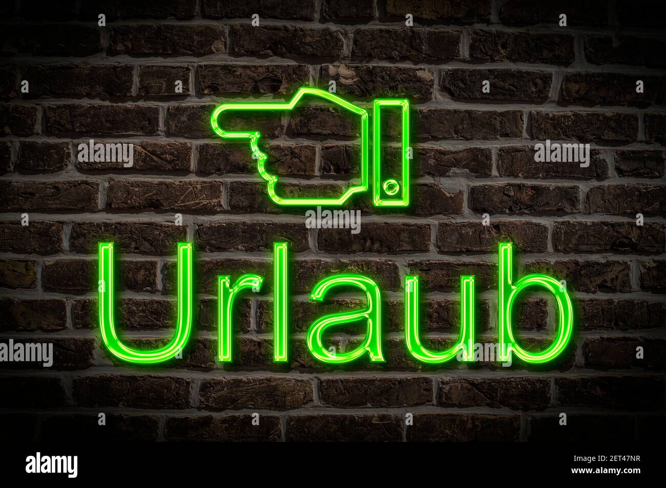 Detail photo of a neon sign on a wall with the inscription Urlaub (Holiday) Stock Photo