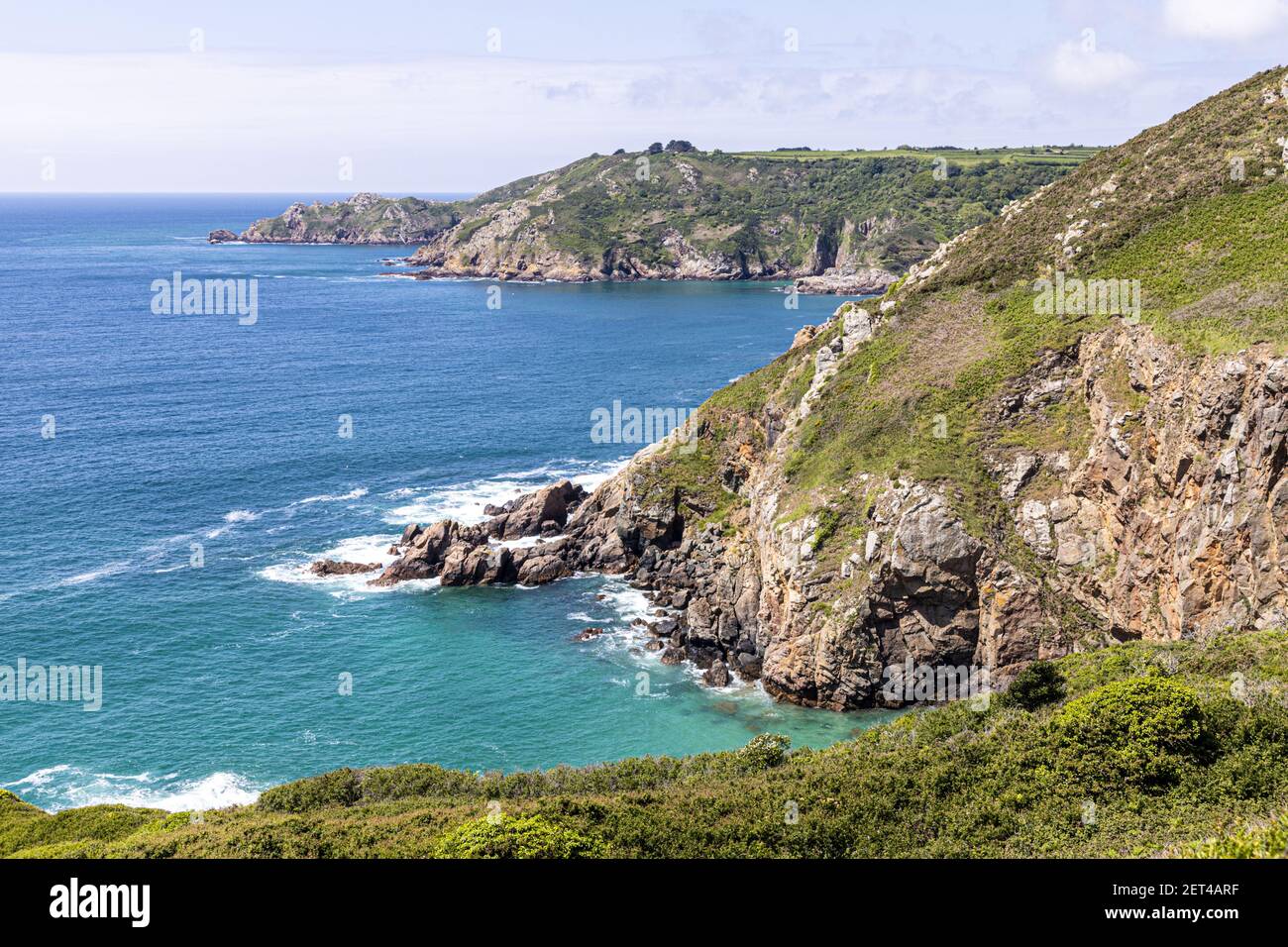 The beautiful rugged south coast of Guernsey, Channel Islands UK - La Bette Bay viewed from near Icart Stock Photo