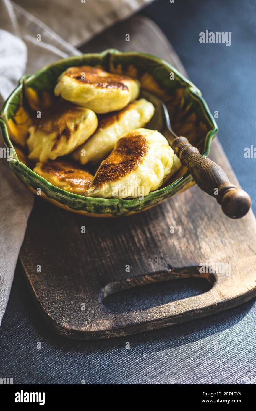 Bowl of fried Ukrainian vareniki dumplings with potato Stock Photo Alamy