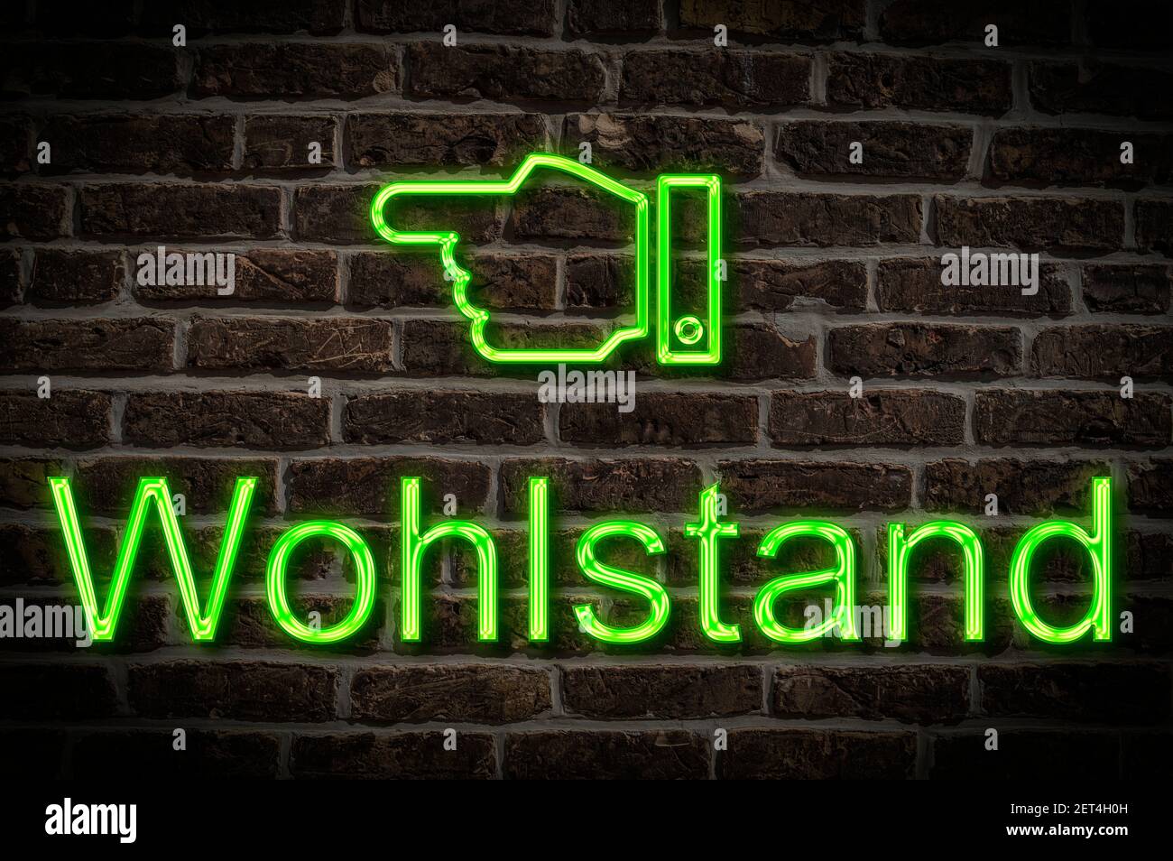 Detail photo of a neon sign on a wall with the inscription Wohlstand (Prosperity) Stock Photo