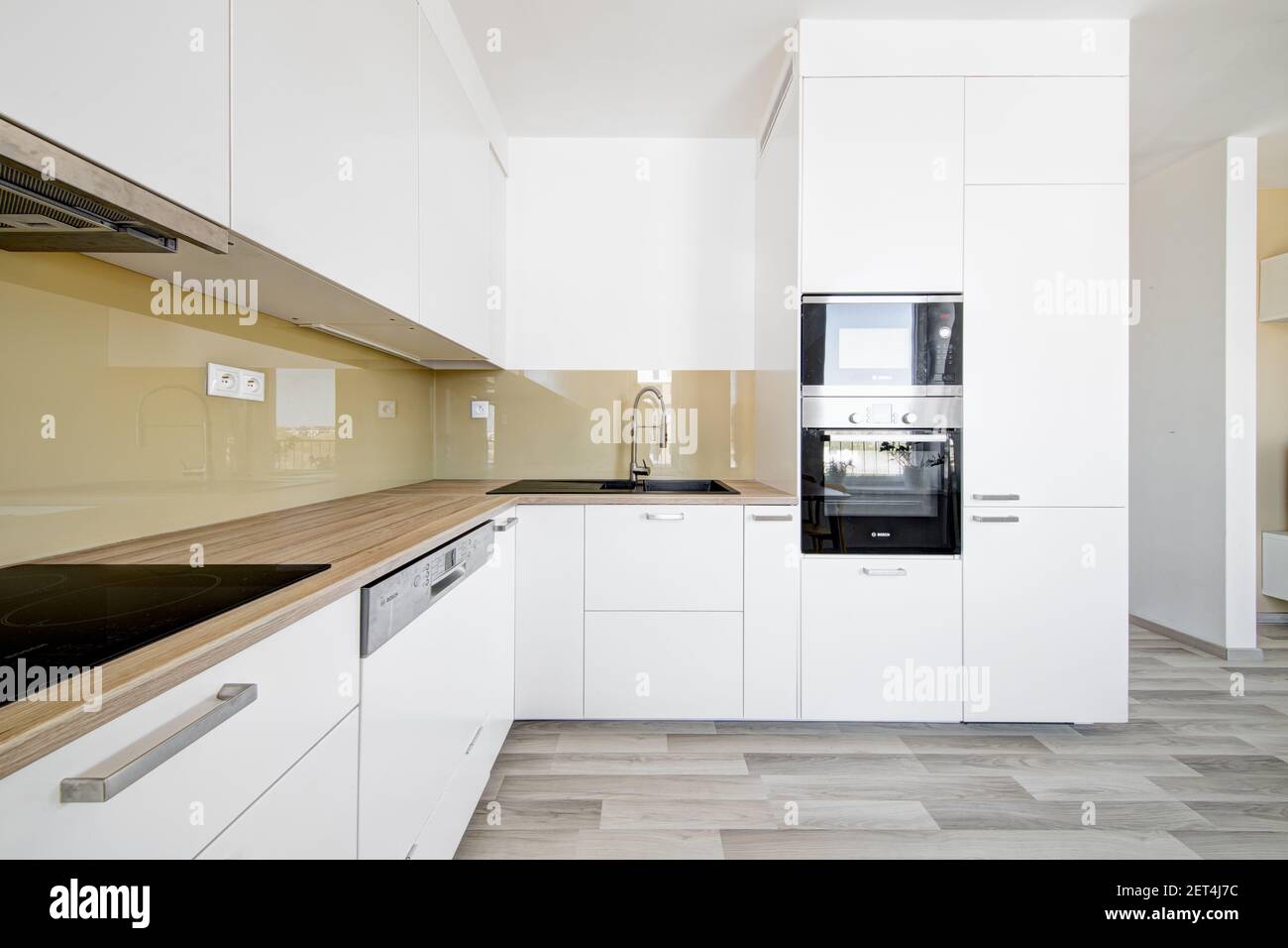 modern white kitchen with built-in appliances Stock Photo