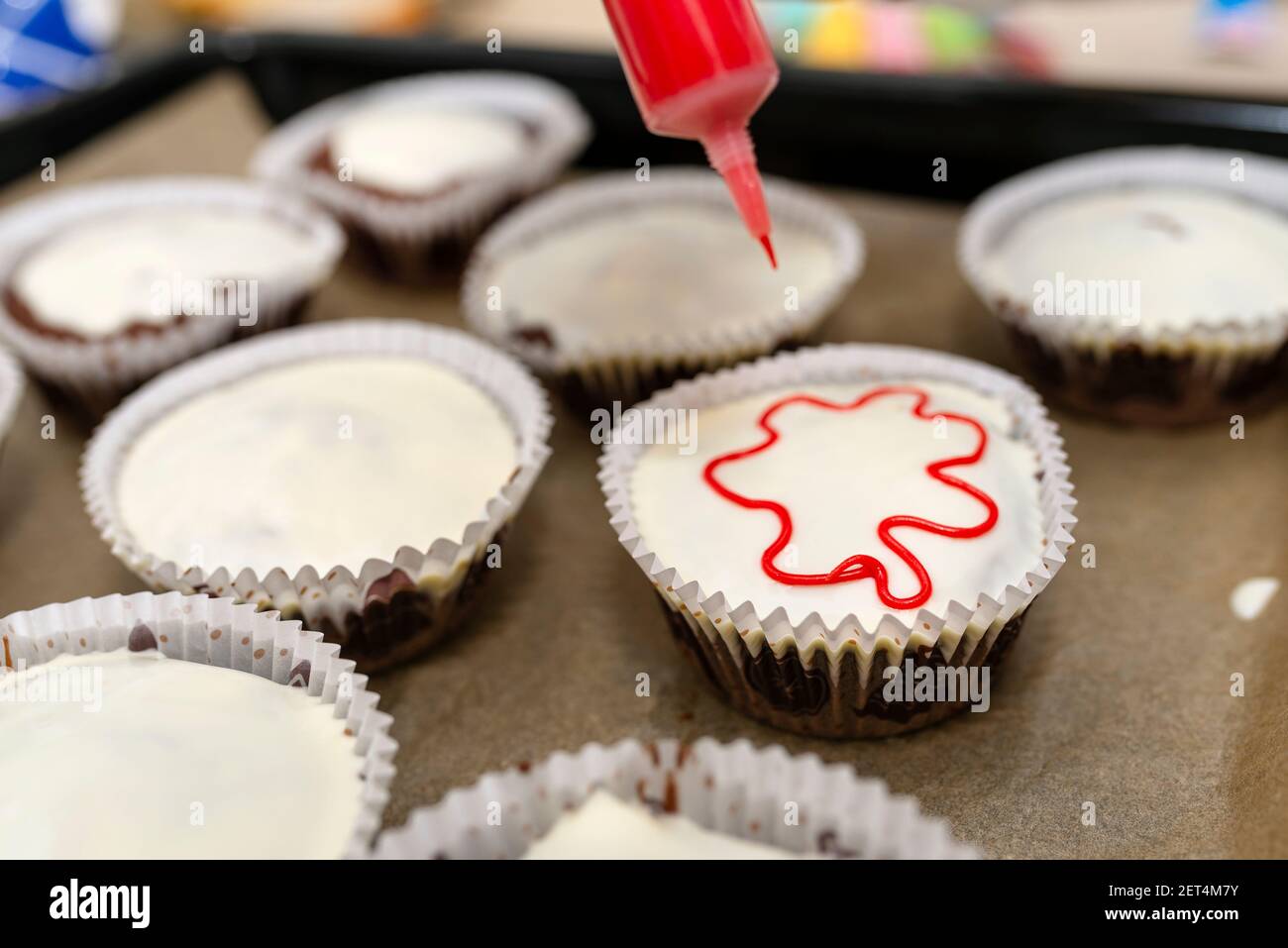 Chocolate muffins with edible eyes in paper holders Stock Photo - Alamy