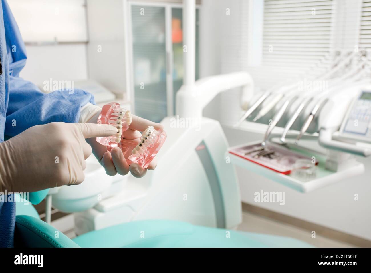 dentist doctor, teaches medical teeth, dental clinic background Stock