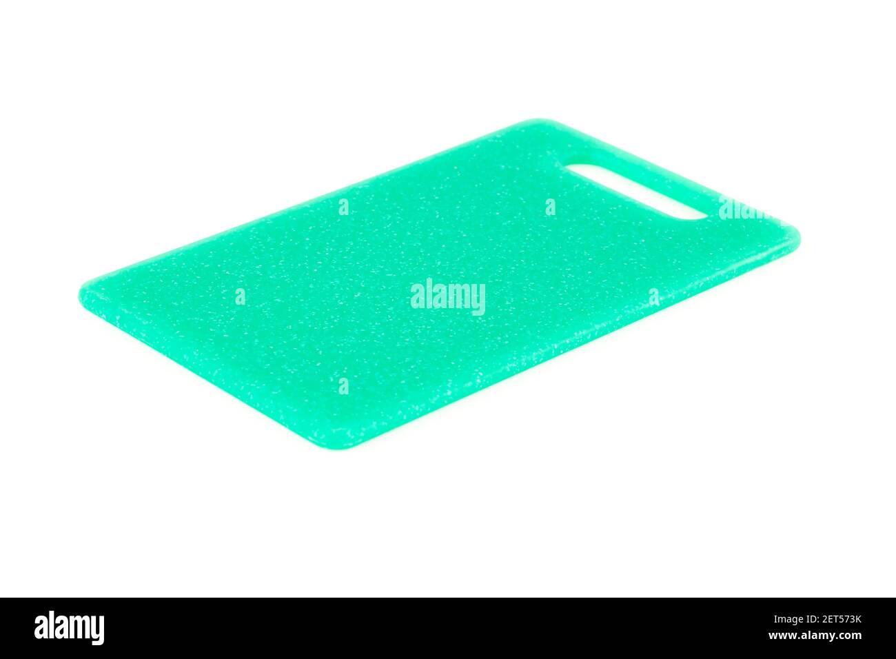 Green plastic cutting board isolated on white background. Stock Photo