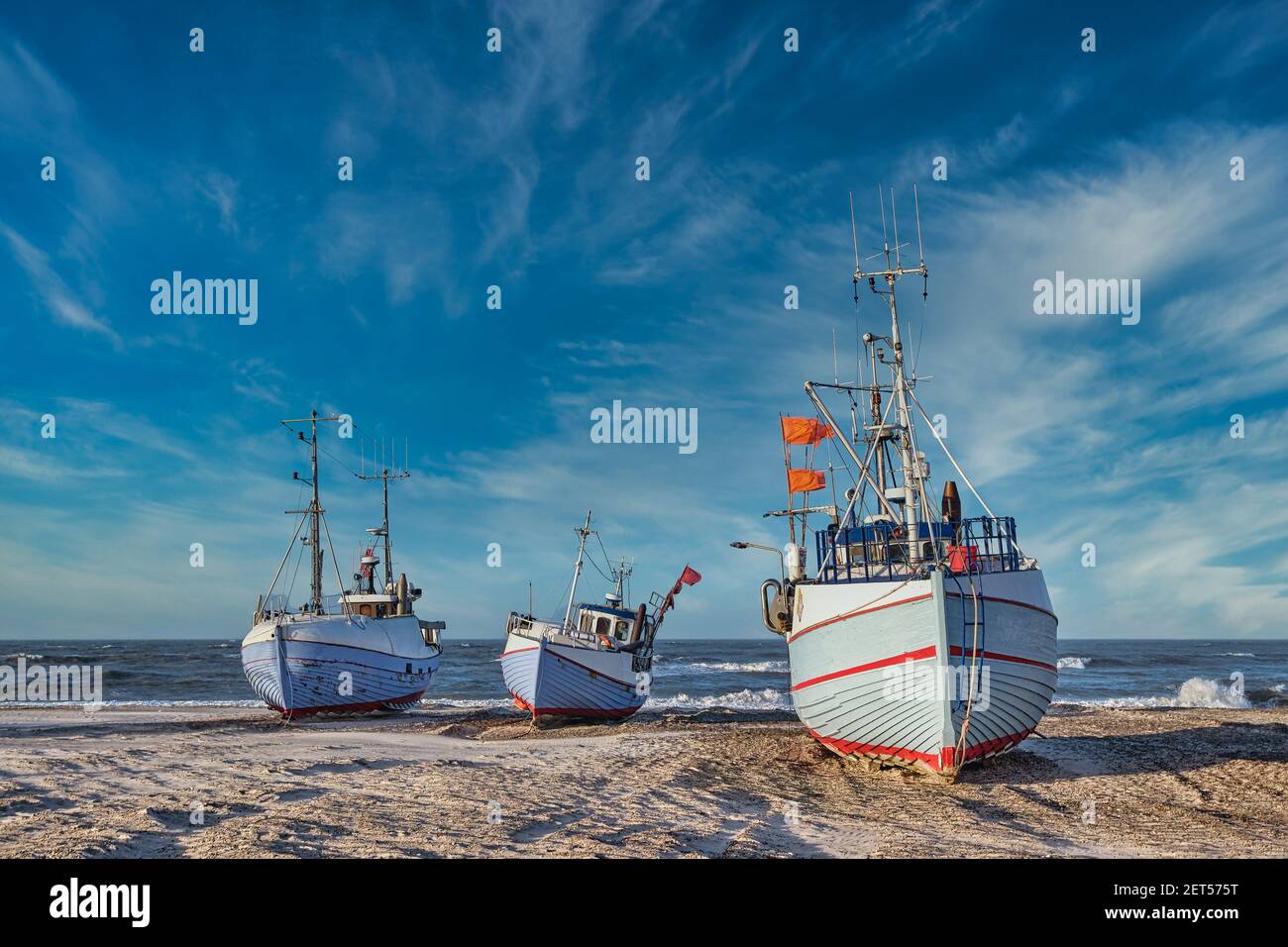 Coastal fishing boats vessels at Thorup beach in Western Denmark Stock