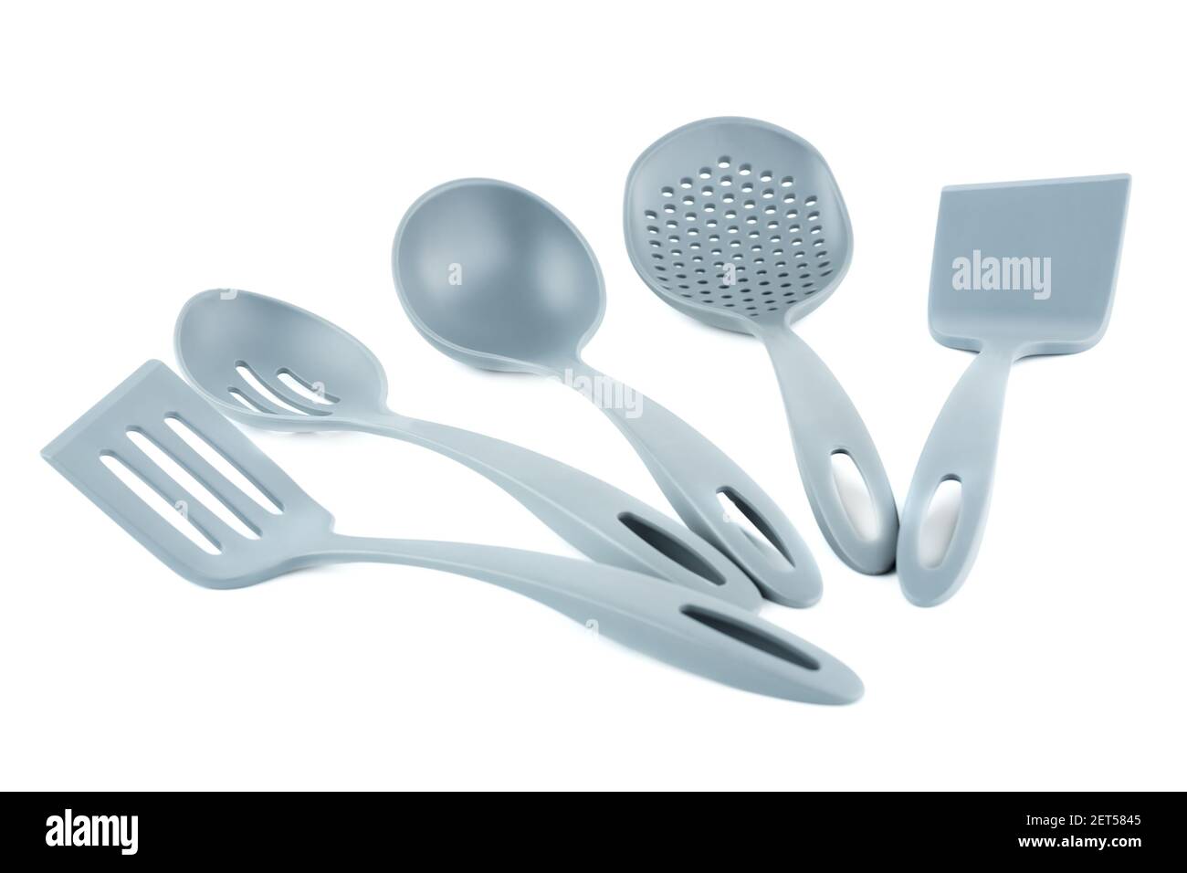 Set of gray plastic kitchen utensils isolated on white background. Stock Photo