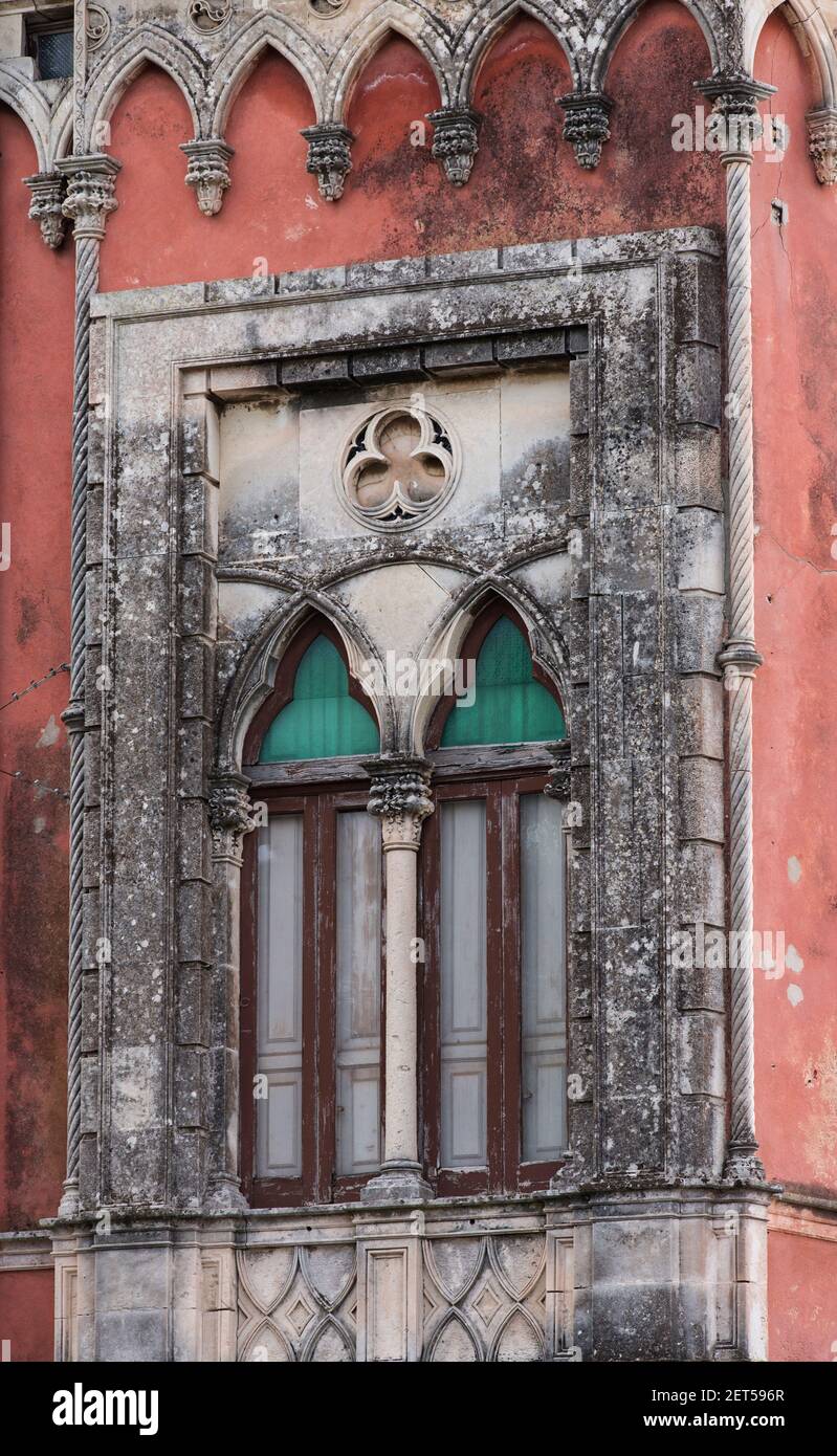 Italy,Sicily,Ortigia, facade of a building showing window treatments in a Venetian style Stock Photo