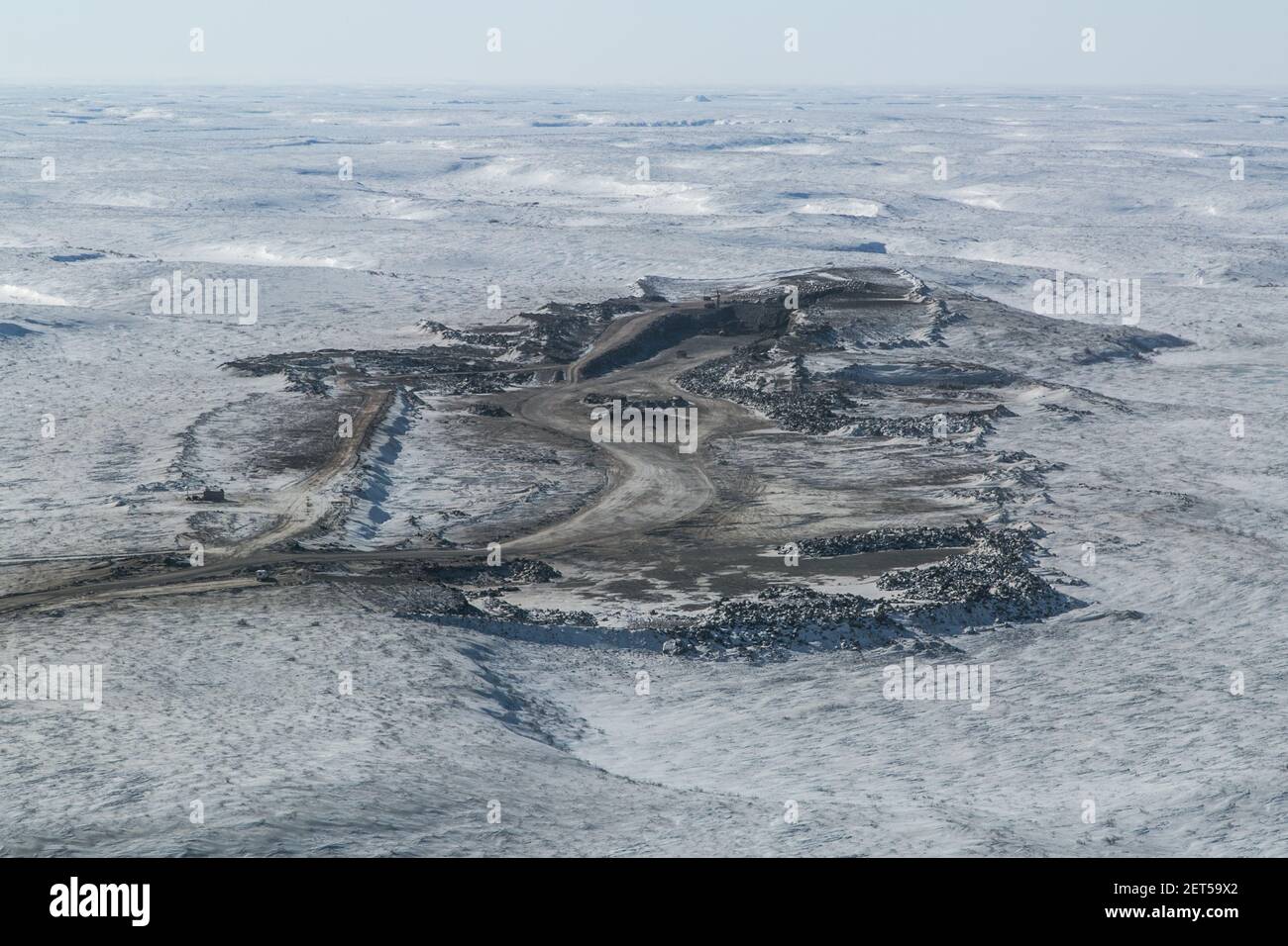 Aerial view of one of the gravel pits used to build the Inuvik-Tuktoyaktuk Highway, Northwest Territories, Canada's Arctic. (April 2014) Stock Photo