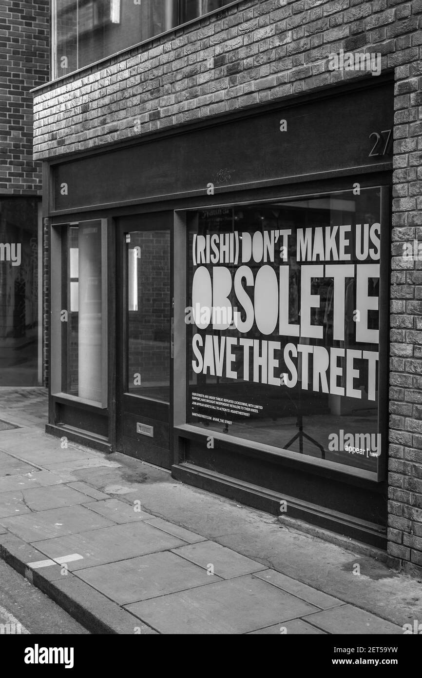 Monochrome image of a message on a shop window in Soho, London for the UK finance minster, Rishi Sunak ahead of the budget. Stock Photo