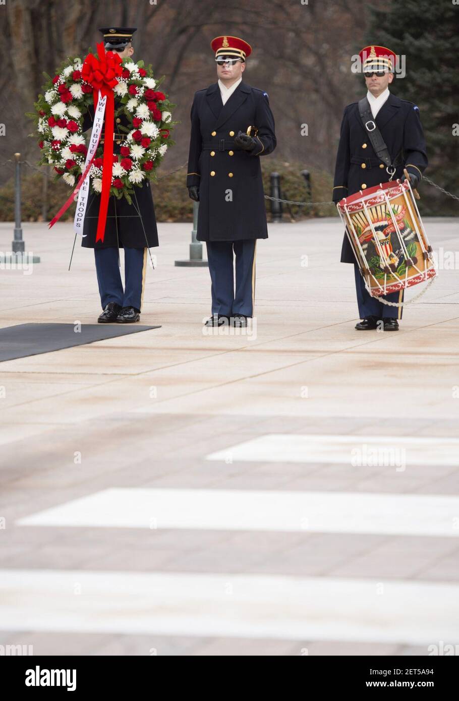 Paul “Triple H” Levesque and WWE Chief Brand Officer Stephanie McMahon place a wreath at the Tomb of the Unknown Soldier in Arlington National Cemetery (31623475505). Stock Photo