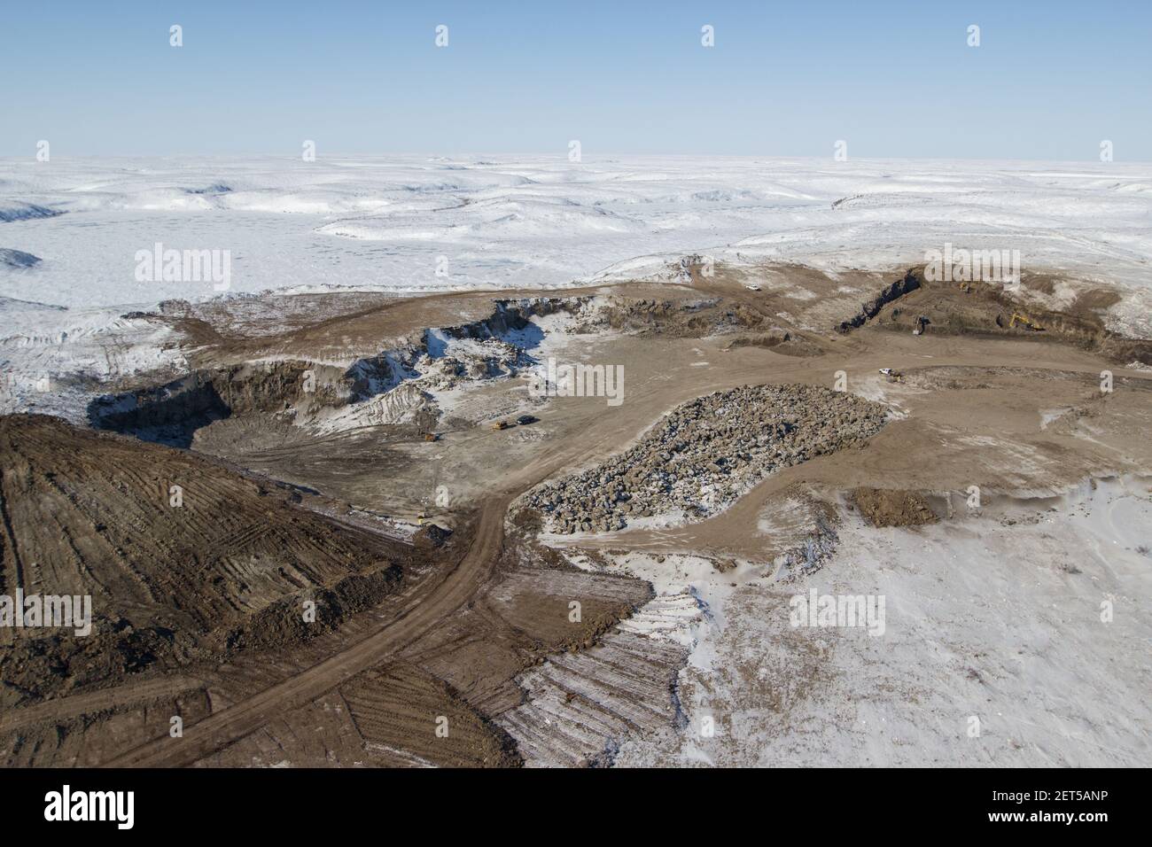 Aerial view of one of the gravel pits used to build the Inuvik-Tuktoyaktuk Highway, Northwest Territories, Canada's Arctic. (April 2014) Stock Photo