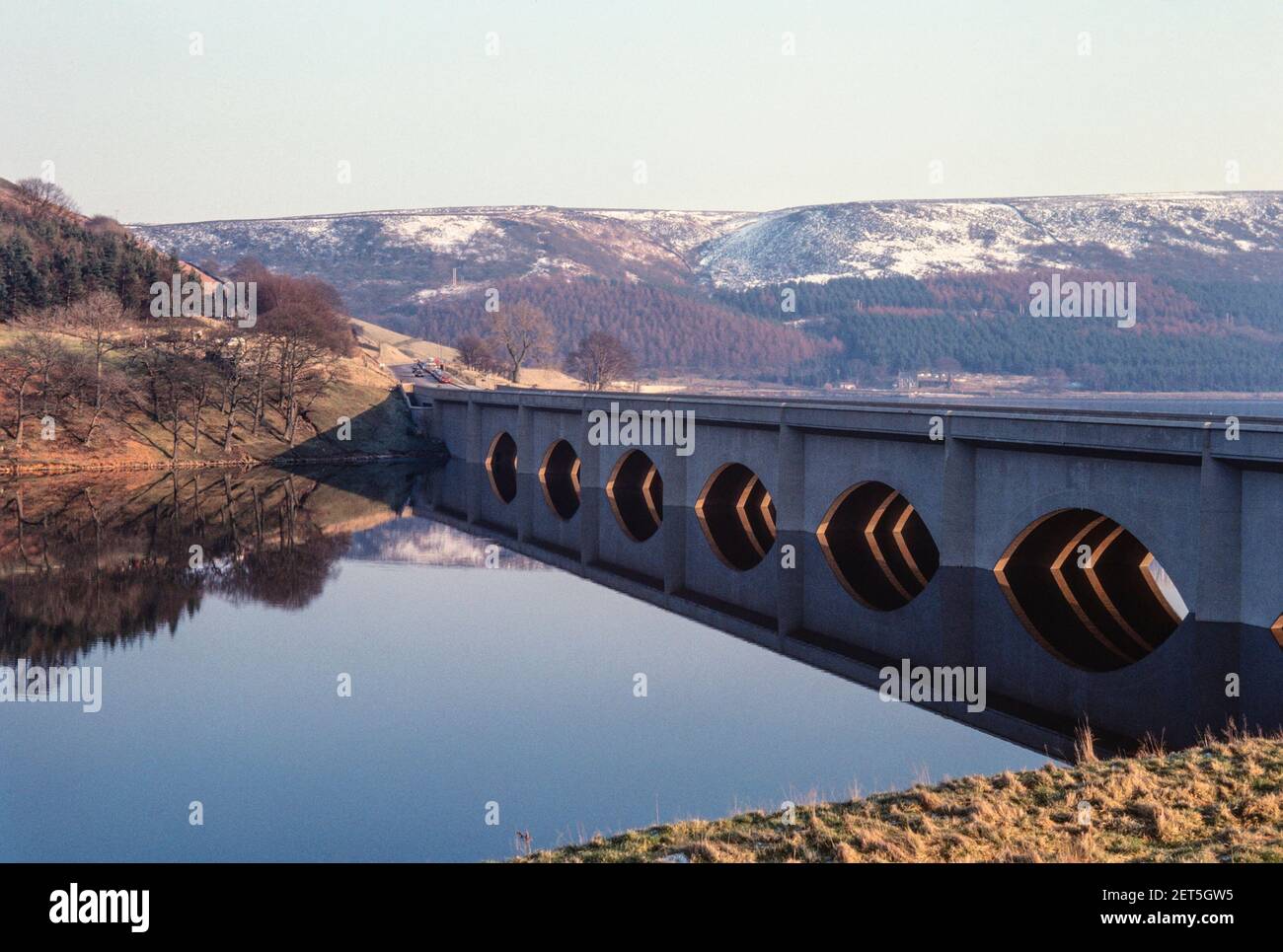 1979 - Ashopton viaduct and reflection of the road bridge in the water. The viaduct bridge carries the A57 road over Ladybower reservoir onto the Snake Pass Derbyshire Peak district national park Derbyshire England UK GB Europe, a57 road peak district Stock Photo