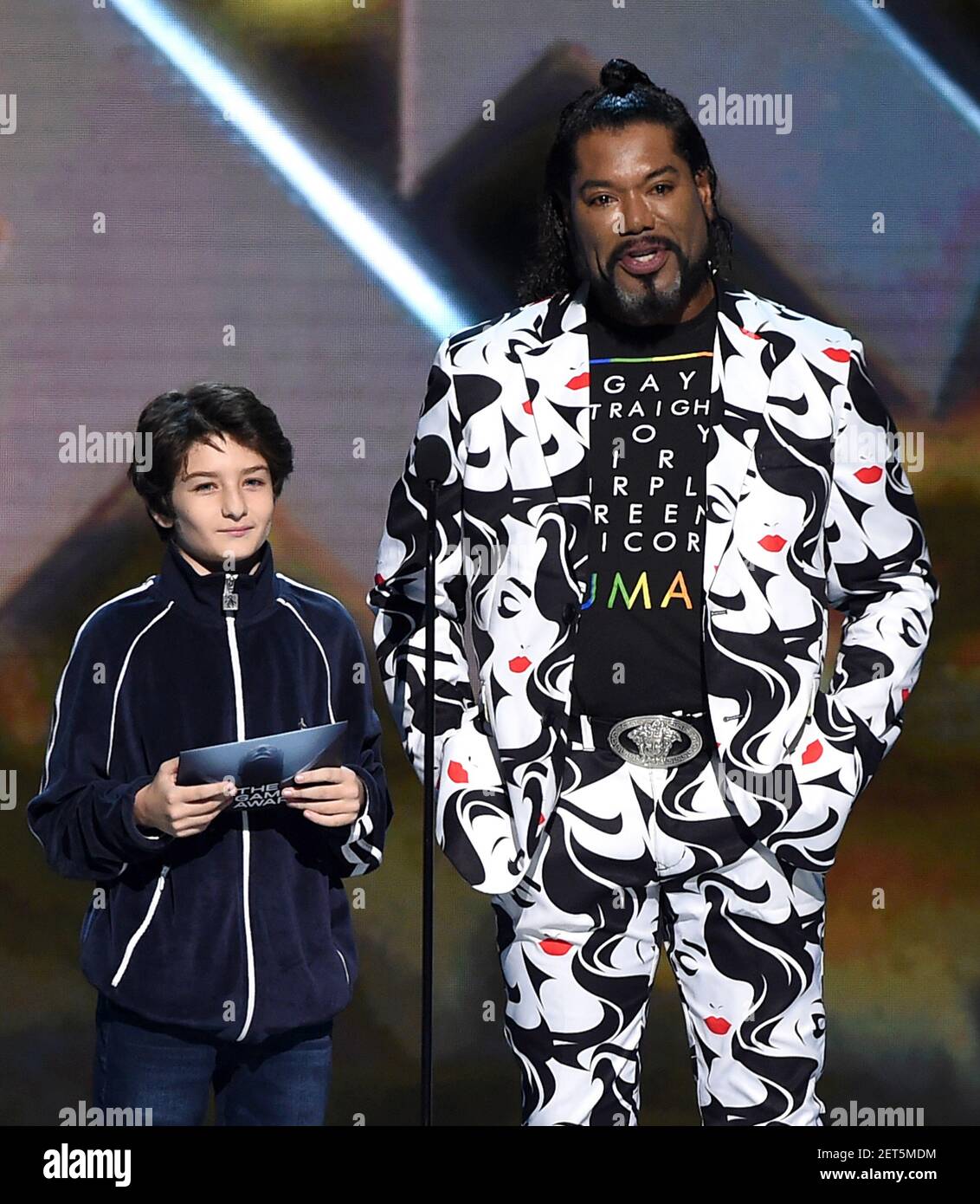 LOS ANGELES - DECEMBER 6: Presenters Sunny Sulijic and Christopher Judge  appear onstage at the 2018 Game Awards at the Microsoft Theater on December  6, 2018 in Los Angeles, California. (Photo by