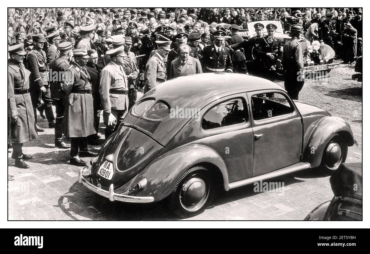 1930's ADOLF HITLER with DR. PORSCHE at the launch event of 'the people's car' KDF VW Volkswagen Beetle prototype a groundbreaking air-cooled motorcar at Fallersleben Wolfsburg Germany May 1938 Adolf Hitler’s Open Top Mercedes Motorcar in background The Mercedes-Benz 770 Grosser Offener Tourenwagen Stock Photo
