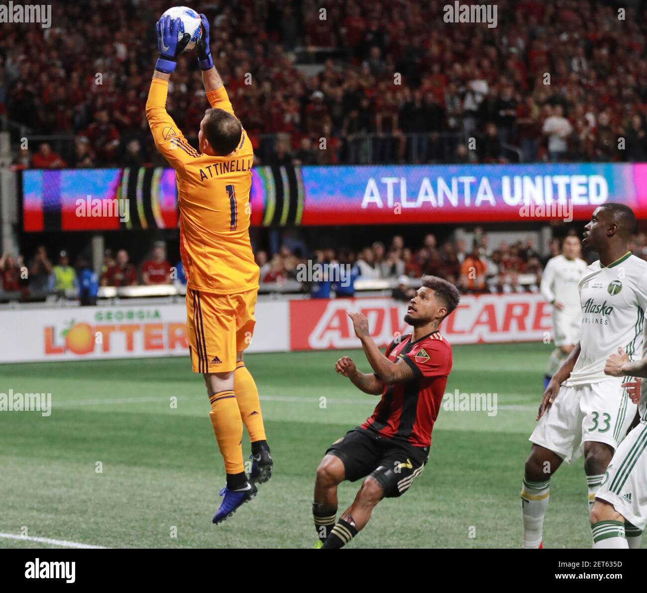 Portland Timbers goalkeeper Jeff Attinella (1) saves a United shot as