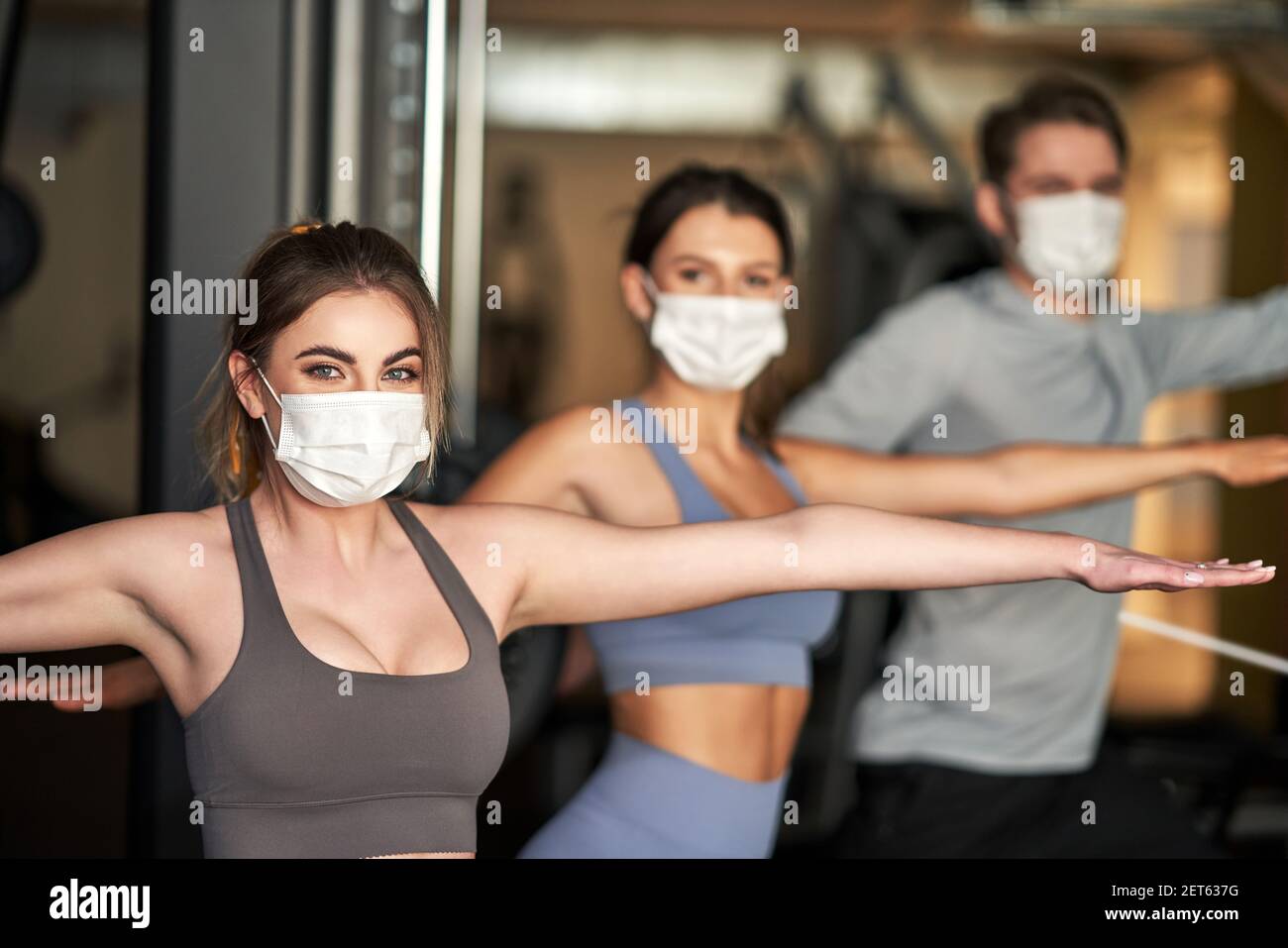Group of people wearing masks working out in a gym Stock Photo Alamy
