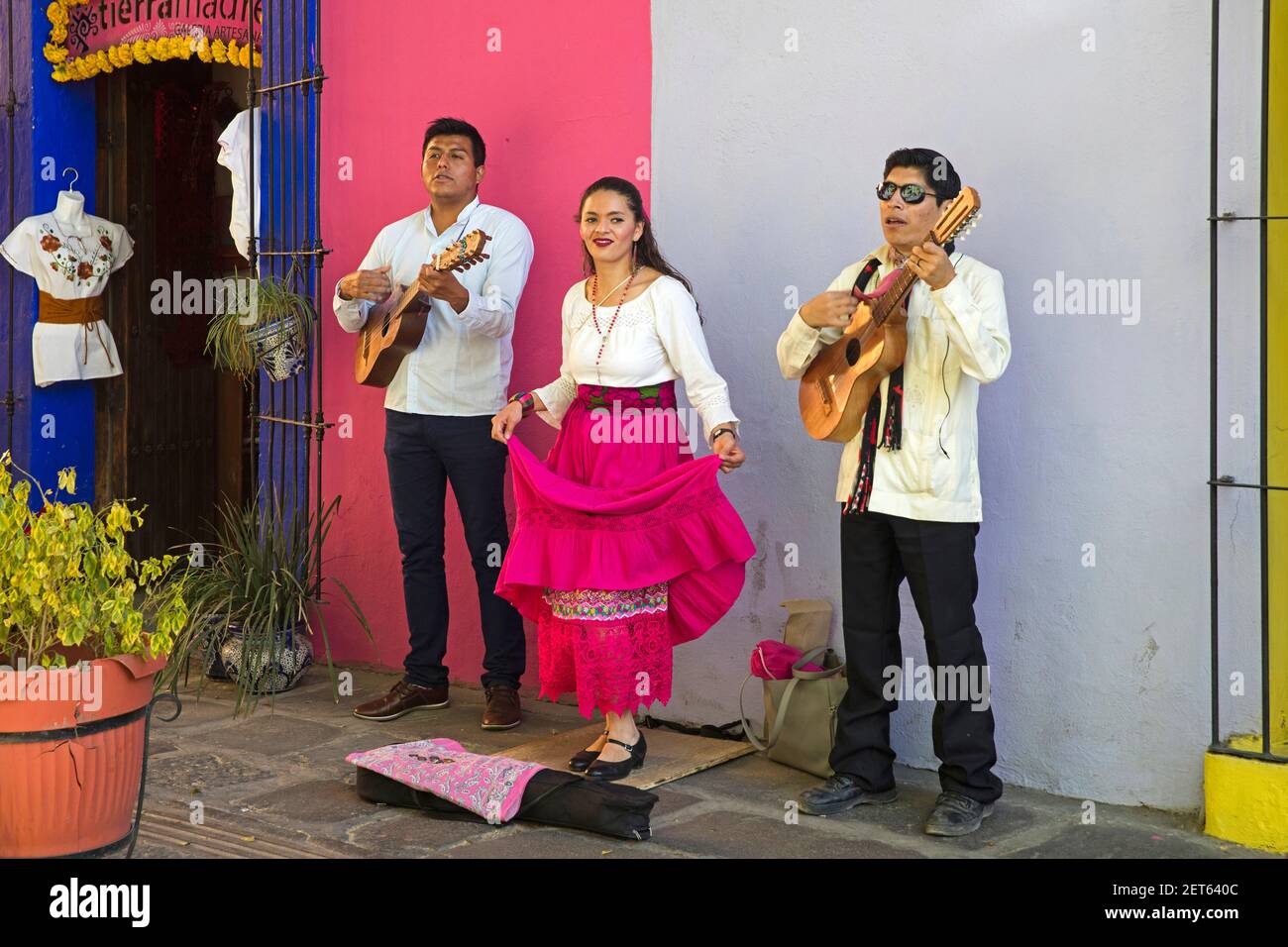 Mexican street musicians playing the guitar and singing in the streets