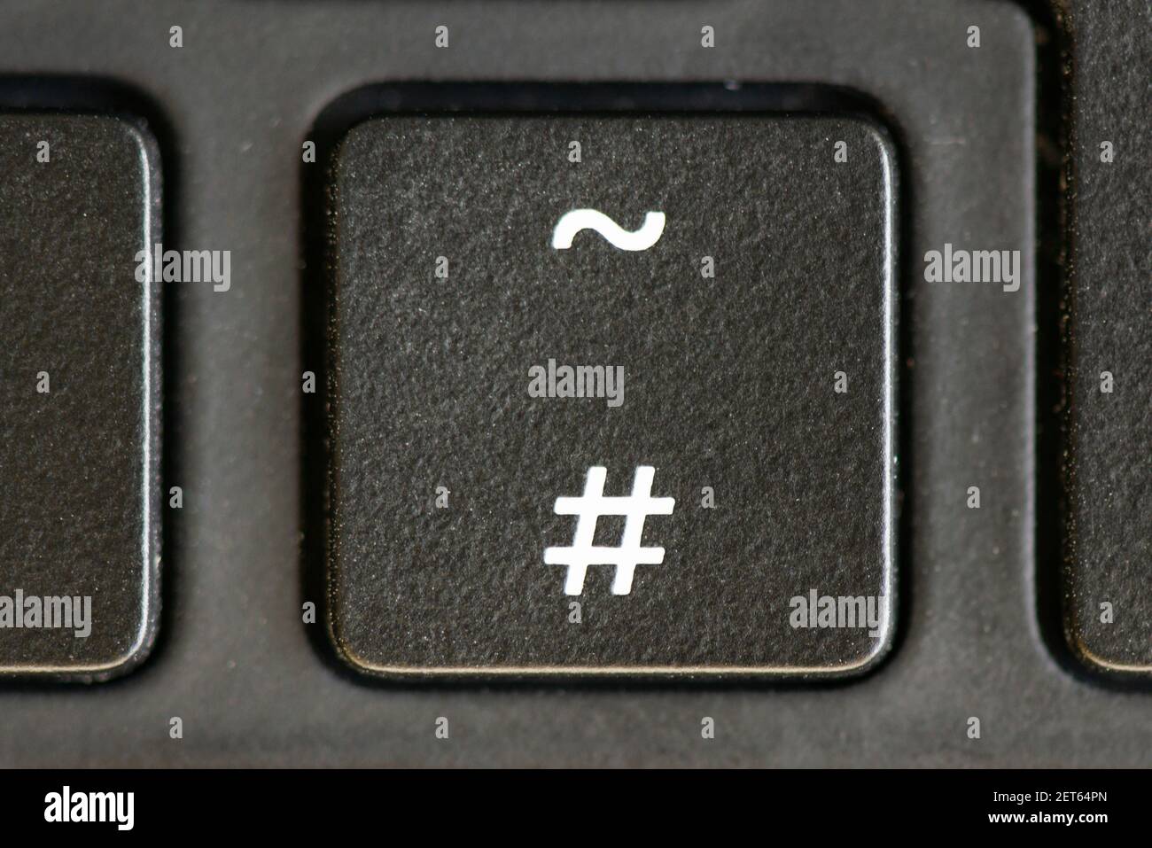 The hash and tilde key on a laptop keyboard Stock Photo