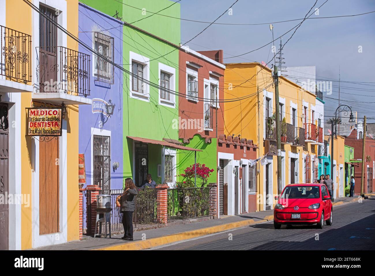 Street with pastel coloured houses in the city Cholula, Puebla, Mexico