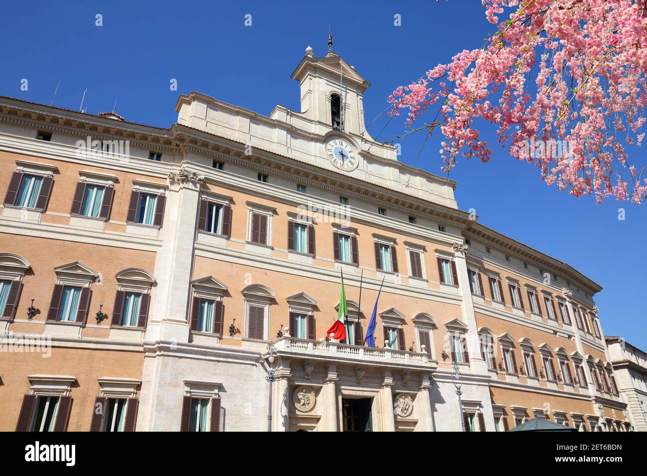 Spring in Rome, Italy. Rome landmark. Montecitorio palace Italian parliament. Cherry blossoms. Stock Photo