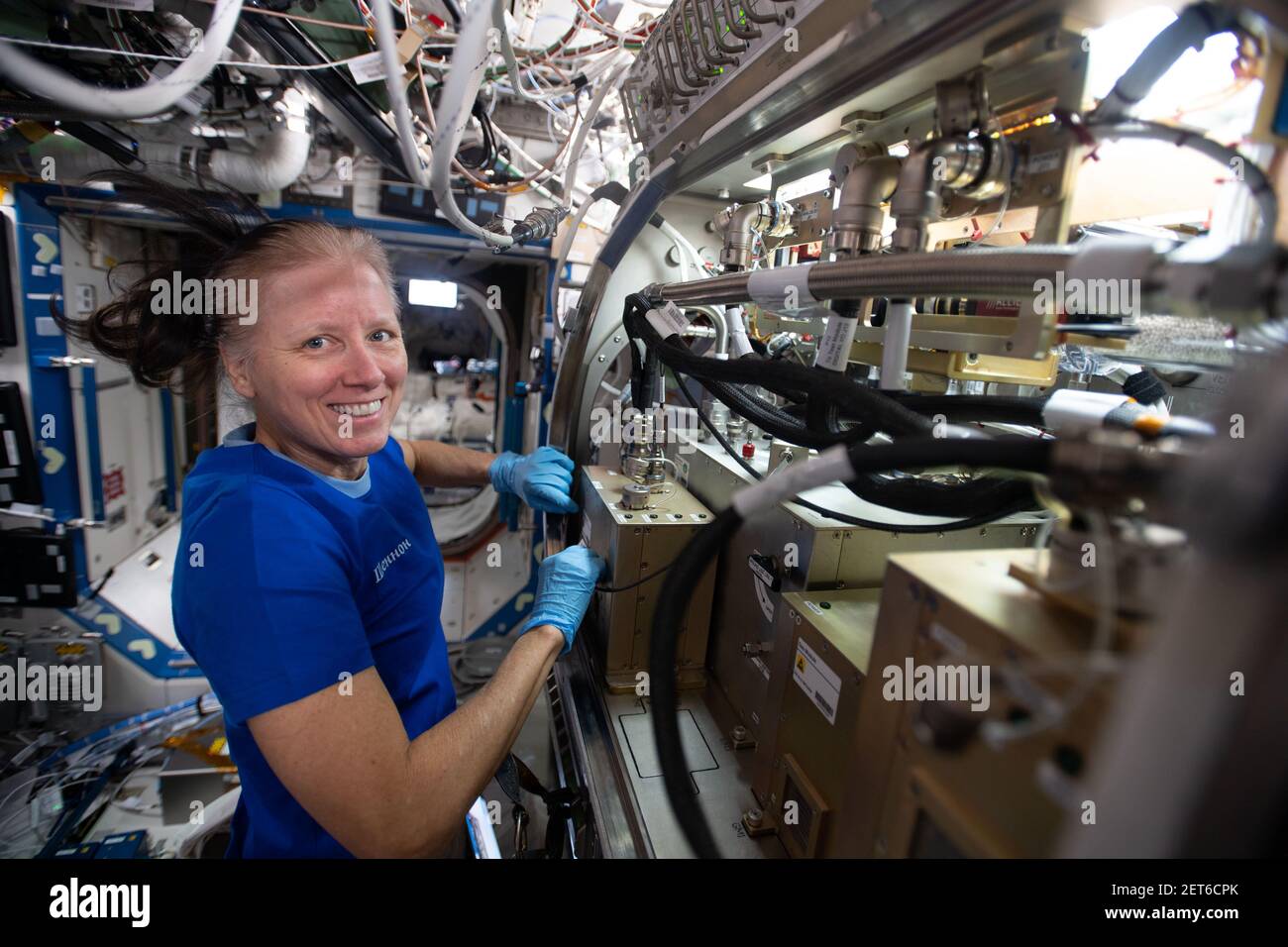 NASA Astronaut Shannon Walker, setting up study about fluids and gases behave in microgravity conditions, aboard ISS, Feb 19, 2021, by NASA/DPA Stock Photo