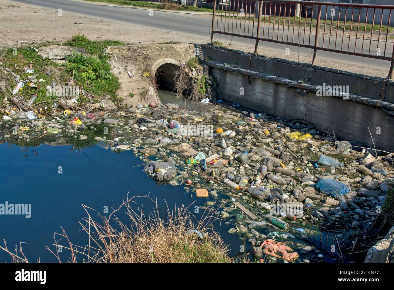 Zrenjanin, Serbia, March 01, 2021. Picture of human negligence and ecological catastrophe on the canal with water and its surroundings. Every life in Stock Photo