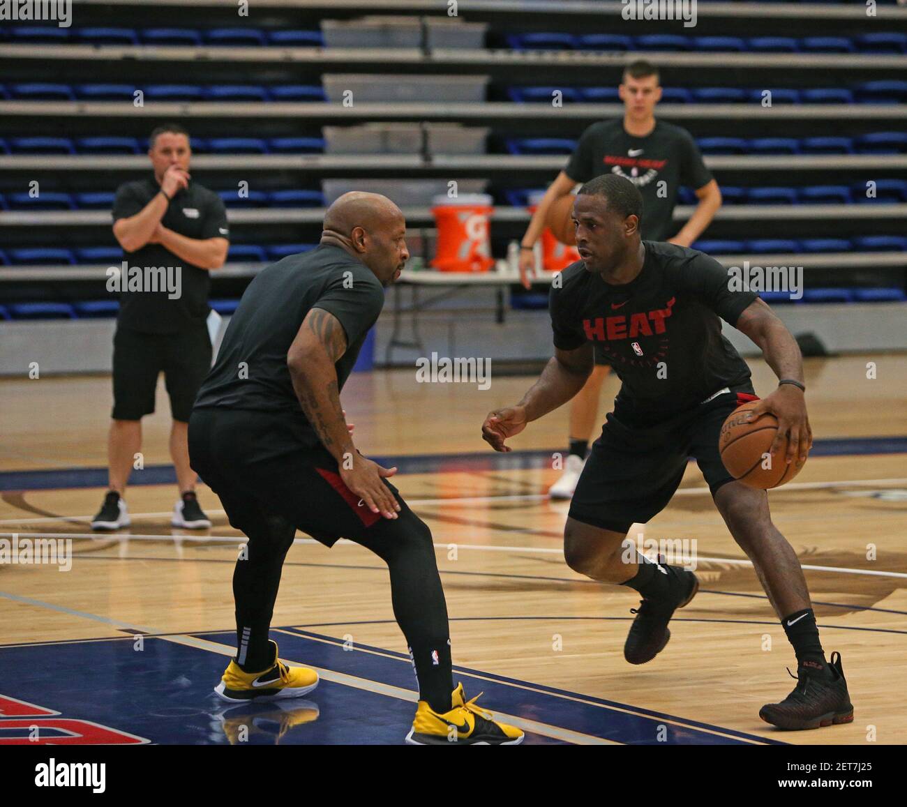 Miami Heat guard Dion Waiters and Heat assistant coach Anthony Carter  running drills during practice on the first day of Miami Heat training camp  in preparation for the 2018-19 NBA season at