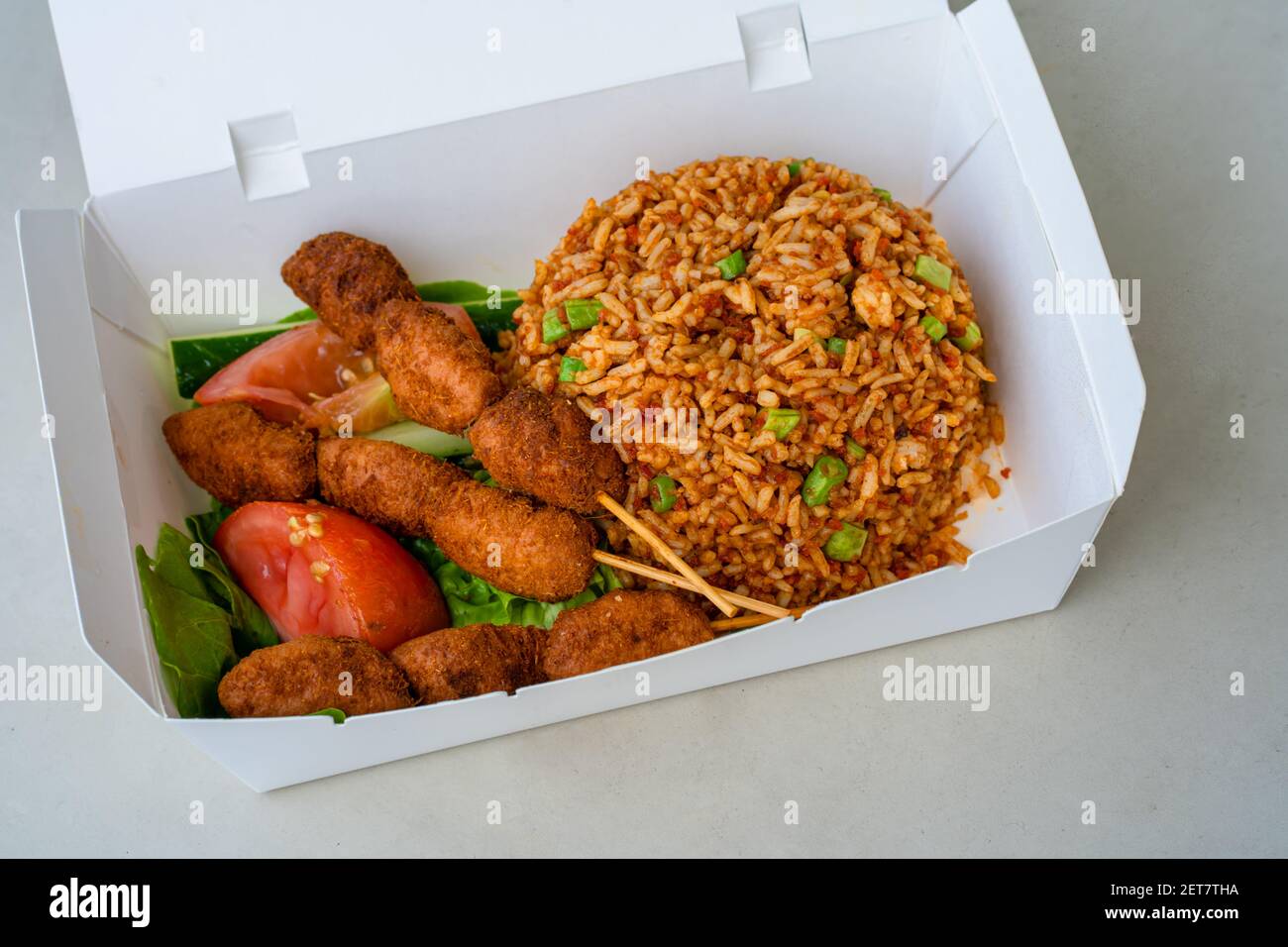Cardboard boxes with hot rice to go. Food delivery Stock Photo - Alamy