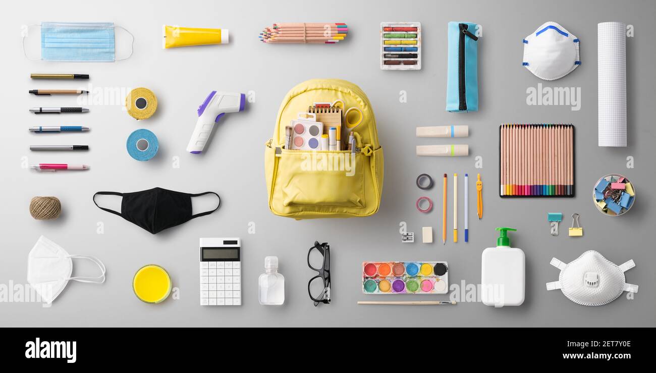 Flat lay top view of face mask and school supplies, back to school and ...