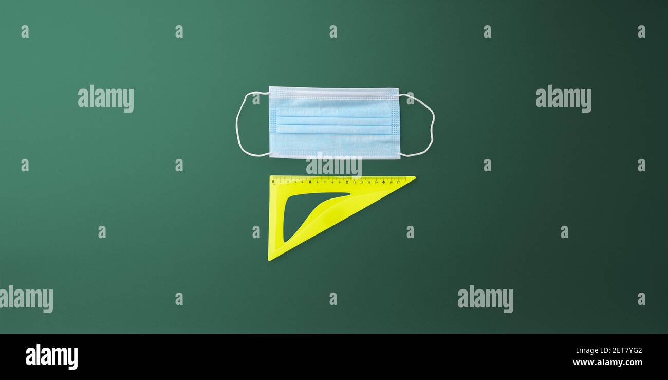 Face Mask Ruler Flat lay top view of face mask and ruler, back to school and ...