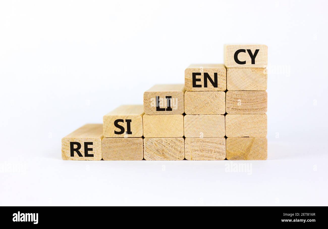 Resiliency symbol. Wooden blocks with word 'resiliency' stacking as ...