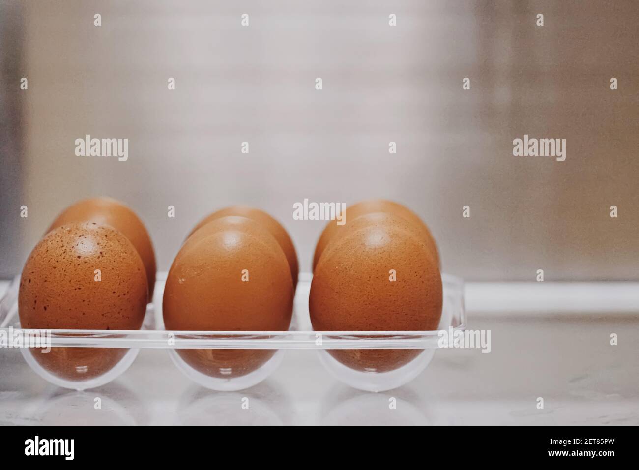 fresh eggs in refrigerator, dairy product closeup Stock Photo Alamy