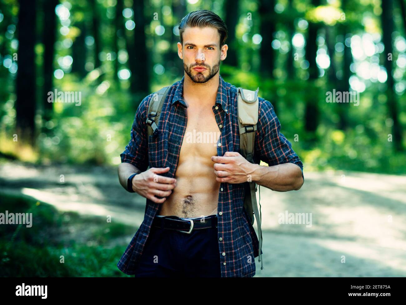 Tourist with backpack traveling in nature. Adventure, travel, tourism, hike and people concept. Stock Photo