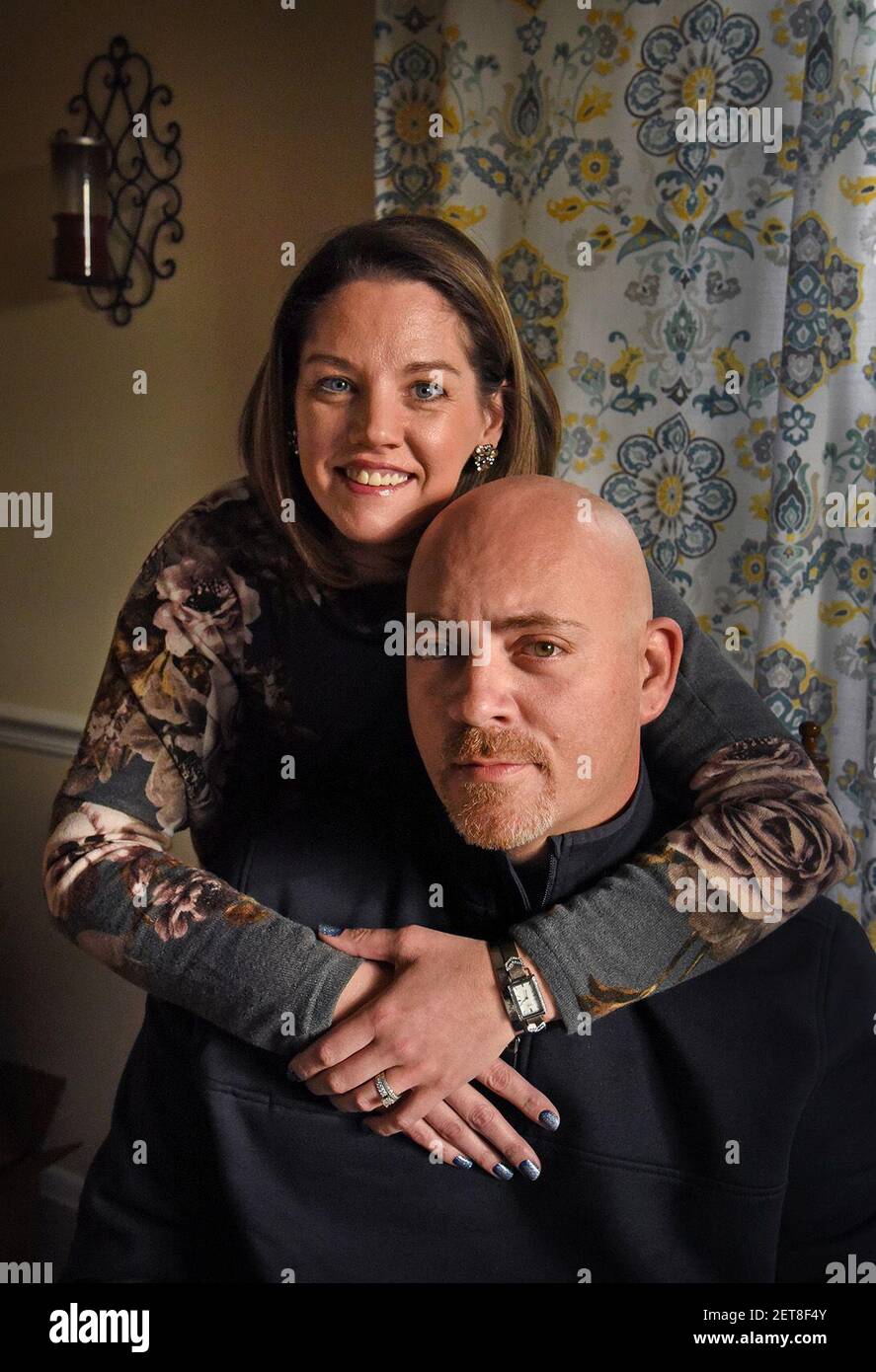 Dan Gosnell with his wife, Noelle, at home. Gosnell, 40, a former