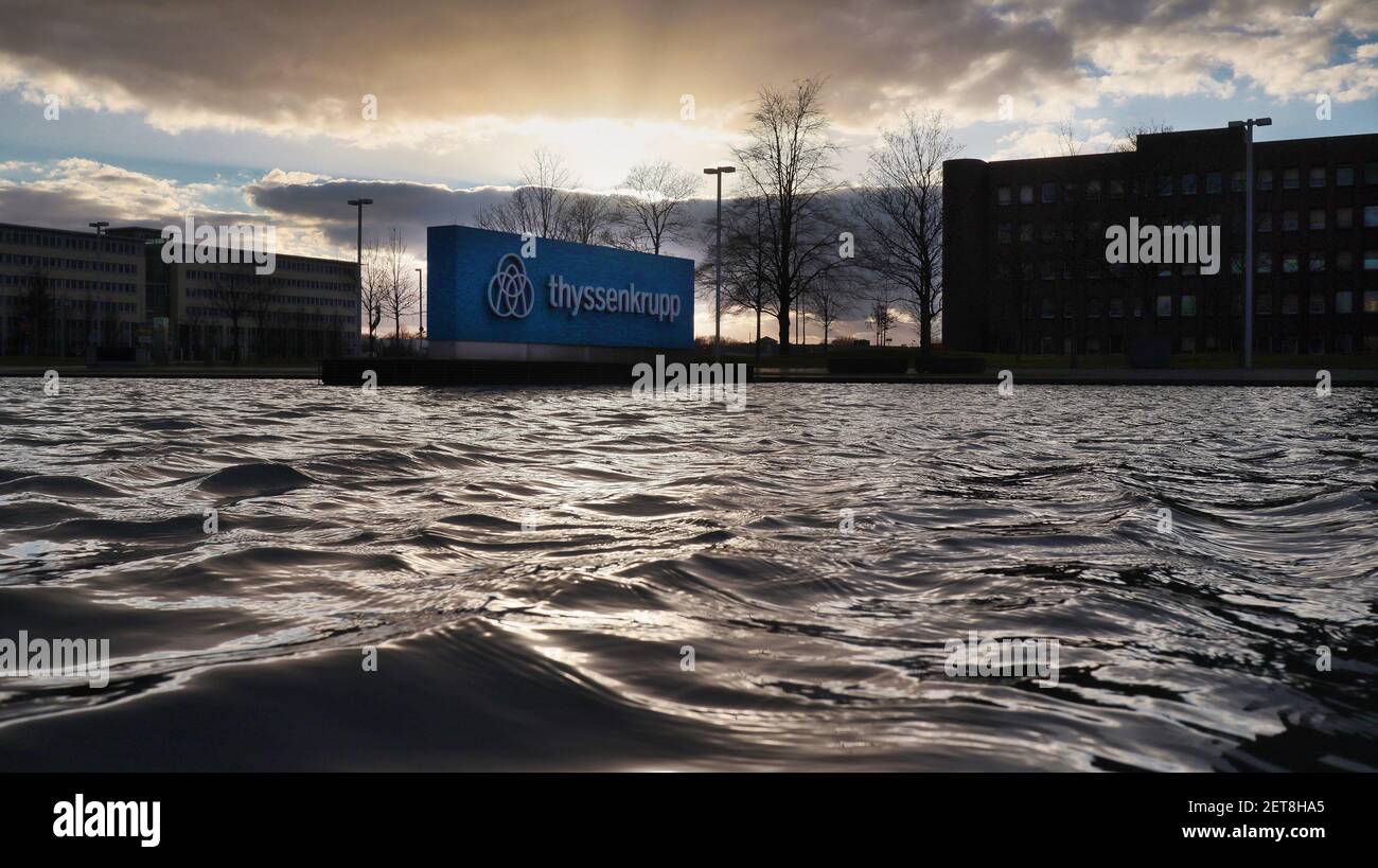 ESSE, GERMANY - Feb 26, 2021: Essen, NRW, Deutschland, 02-26-2021 Thyssen krupp company logo in moving Water against sundown - headquarters Thyssen kr Stock Photo