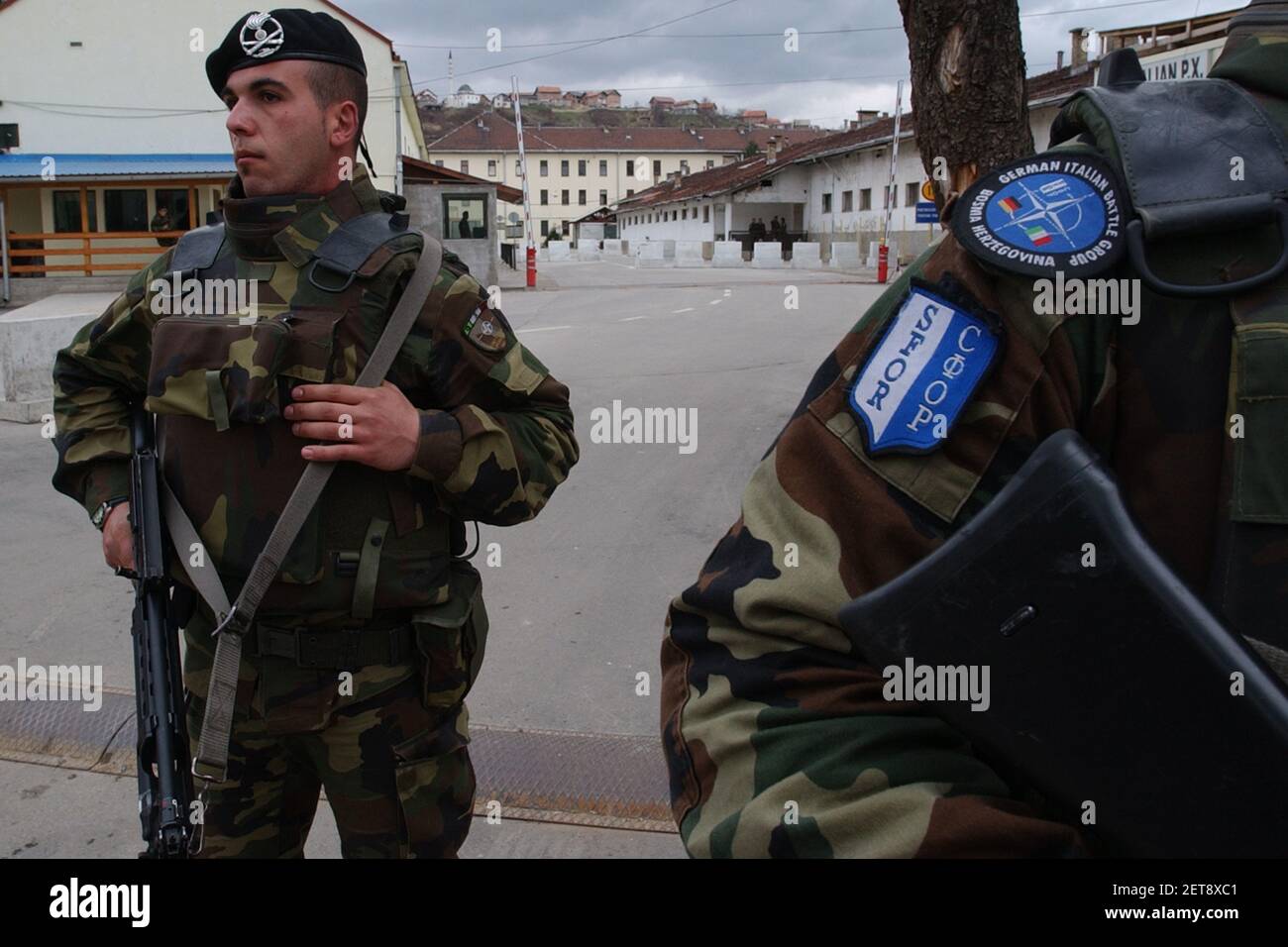 Italian soldiers, members of the NATO-led peace keeping troops in Bosnia stand guard at the main entrance to Nato Base Camp Tito barracks, in Sarajevo Stock Photo