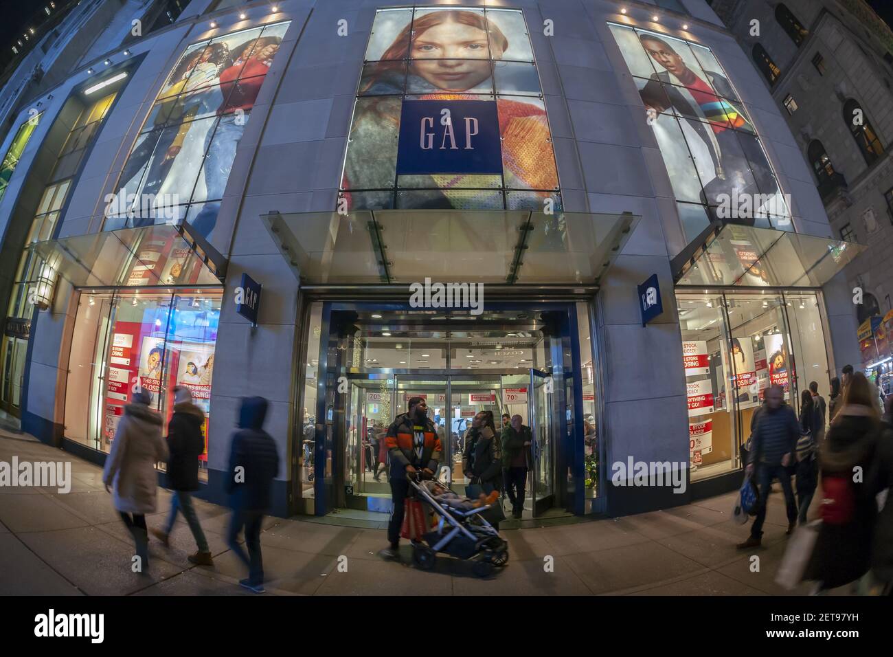 Sale signs decorate the Gap store store on Fifth Avenue in New York on