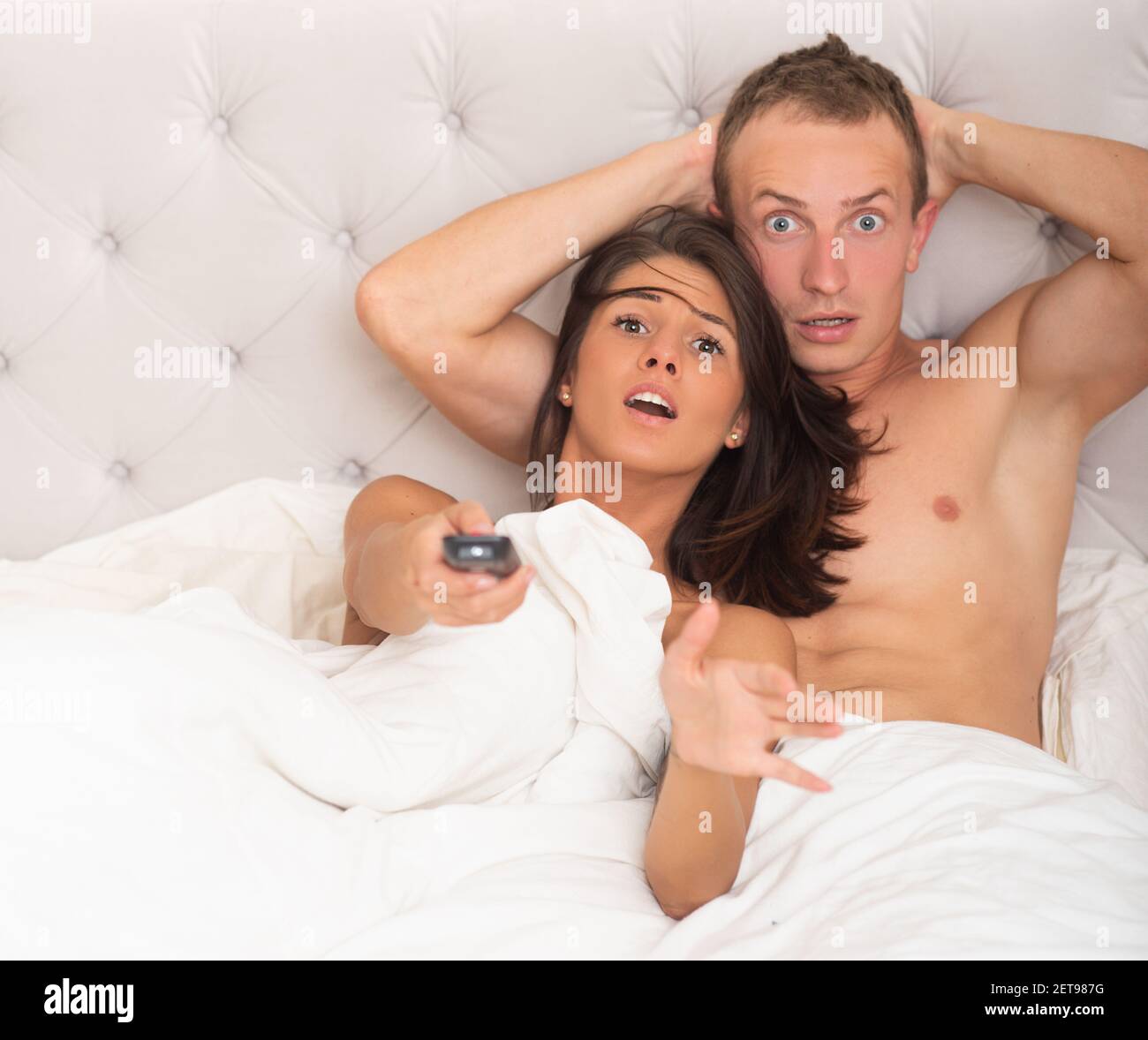 Scary movies. Couple in bed watching horror films picture