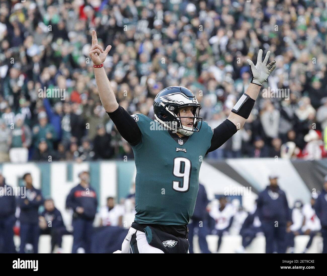 Philadelphia Eagles quarterback Nick Foles raises his arms after
