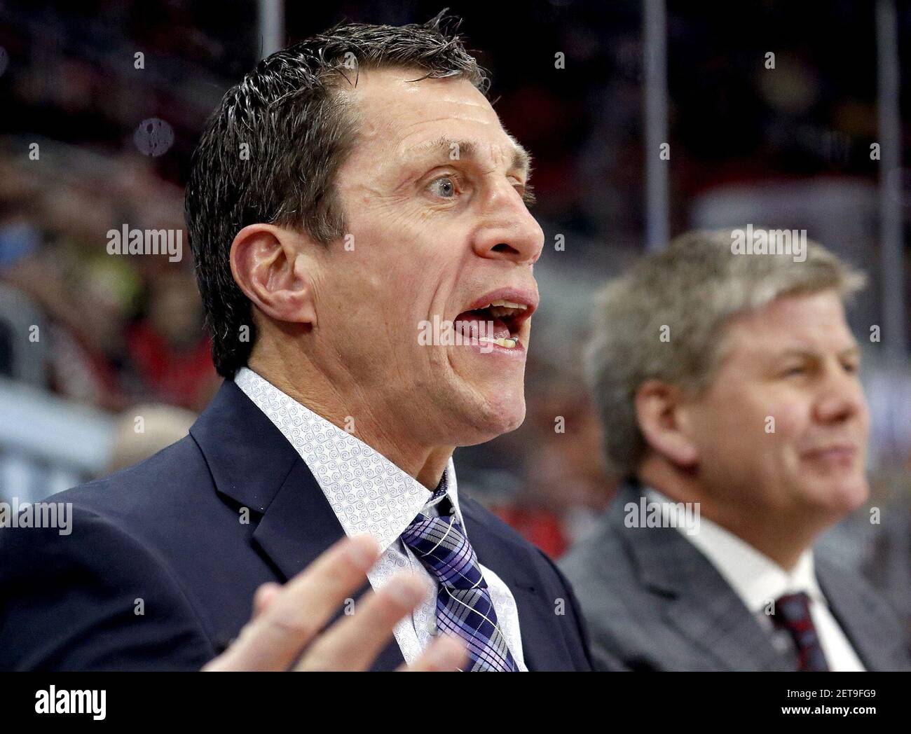In a March 2018 file image, Carolina Hurricanes coach Rod Brind'Amour, left, argues a ruling in action against the Arizona Coyotes at PNC Arena in Raleigh, N.C. On Tuesday, Dec. 31, 2019, Rod Brind'Amour's Hurricanes topped the Montreal Canadiens, 3-1. (Chris Seward/Raleigh News & Observer/TNS) Stock Photo