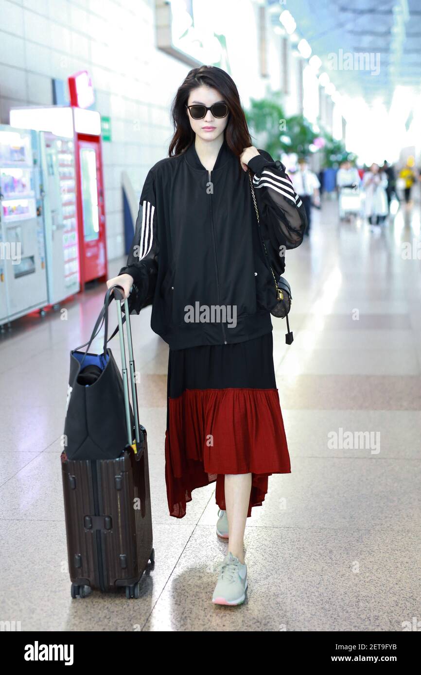 File--In this undated photo, Chinese model He Sui arrives at a Shanghai  airport befoere departure in Shanghai, China. Shoulder bag: Louis Vuitton  (Photo by Wang Jiali/ChinaImages/Sipa USA Stock Photo - Alamy