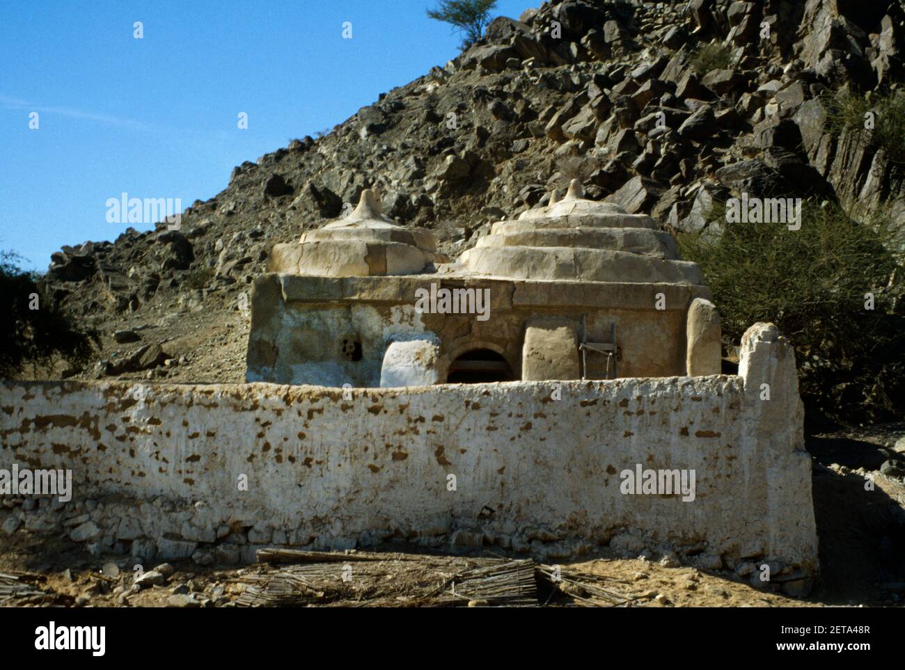 Fujairah UAE Al Bidyah Mosque 15th Century oldest working Mosque in the UAE with Four Domed Roof and Watchtower overlooking the Mosque Stock Photo