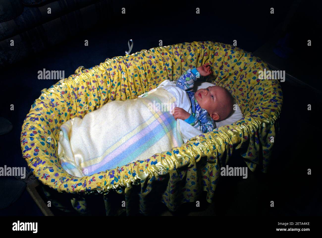 Baby Laying in Moses Basket Surrey England Stock Photo