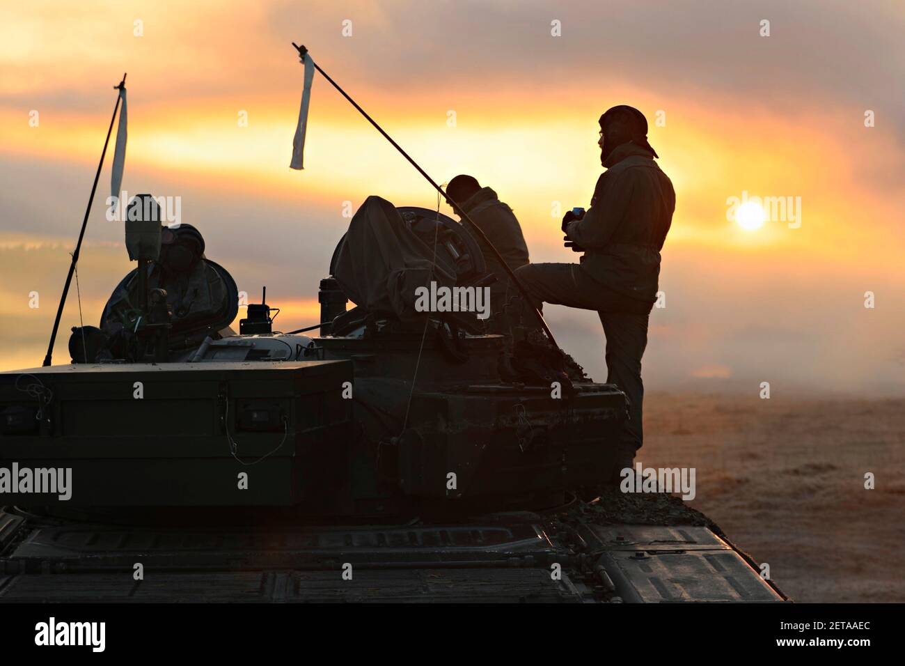 Hohenfels, Germany. 01st Mar, 2021. Slovenian soldiers are silhouetted by sunrise after the final battle during Combined Resolve XV, at the Hohenfels Training Area March 1, 2021 in Hohenfels, Germany. Credit: Planetpix/Alamy Live News Stock Photo