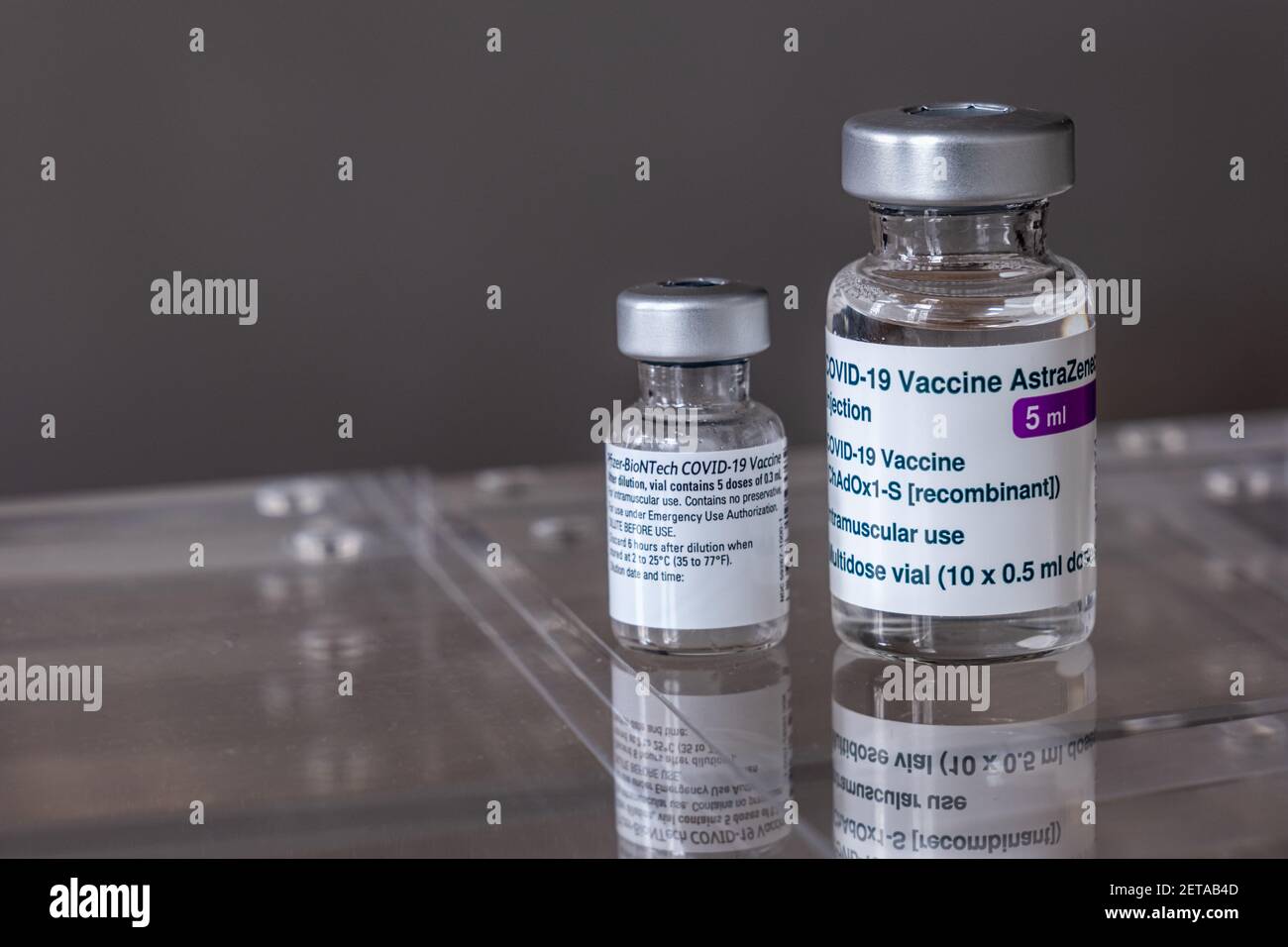 Montreal, CA - 1 March 2021: Vials of Astrazeneca and Pfizer BioNTech Covid-19 vaccines Stock Photo