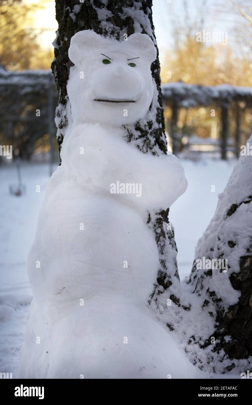A vertical shot of a snowman with an angry facial expression Stock Photo