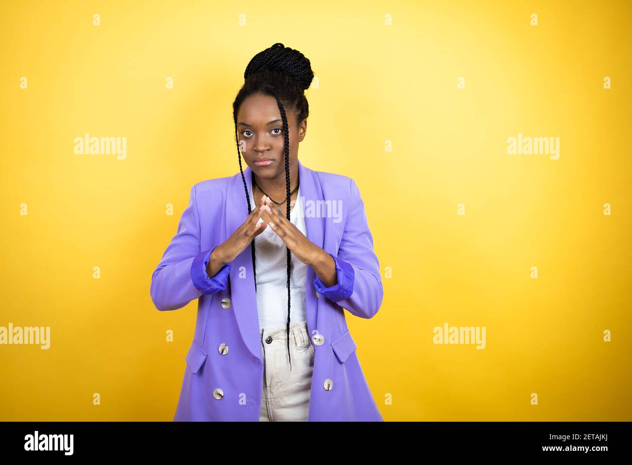 Young african american business woman with Hands together and fingers ...
