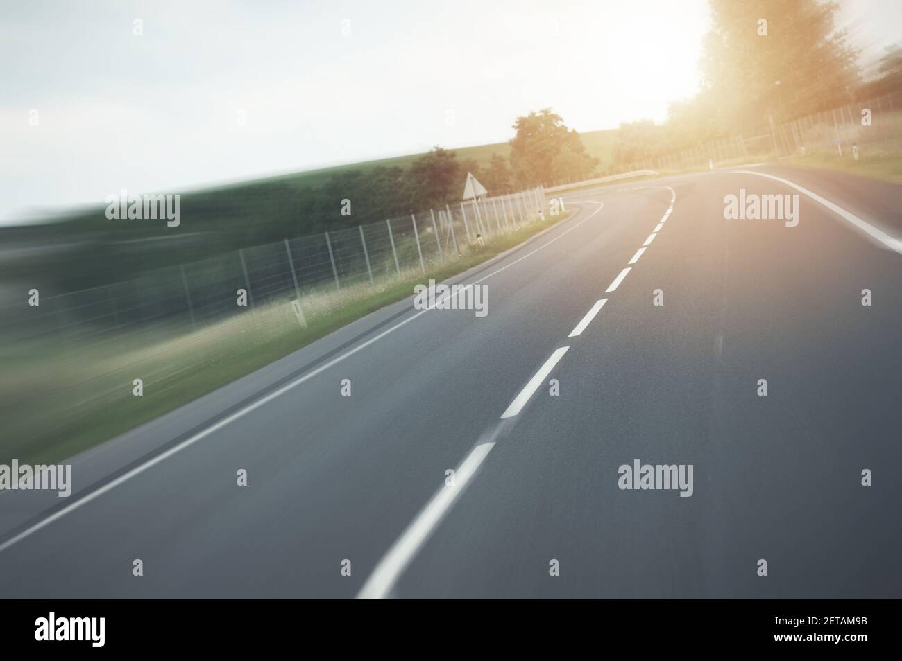 Driving Destination Theme. Speeding on the Highway. New and Modern Highway Drive with Motion Blur Effect. Stock Photo
